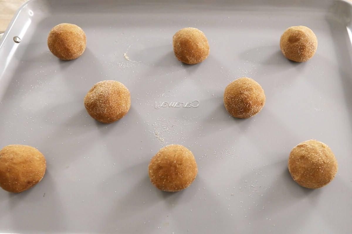 unbaked vegan pumpkin sugar cookies on baking sheet