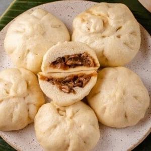siopao asado cut open on plate