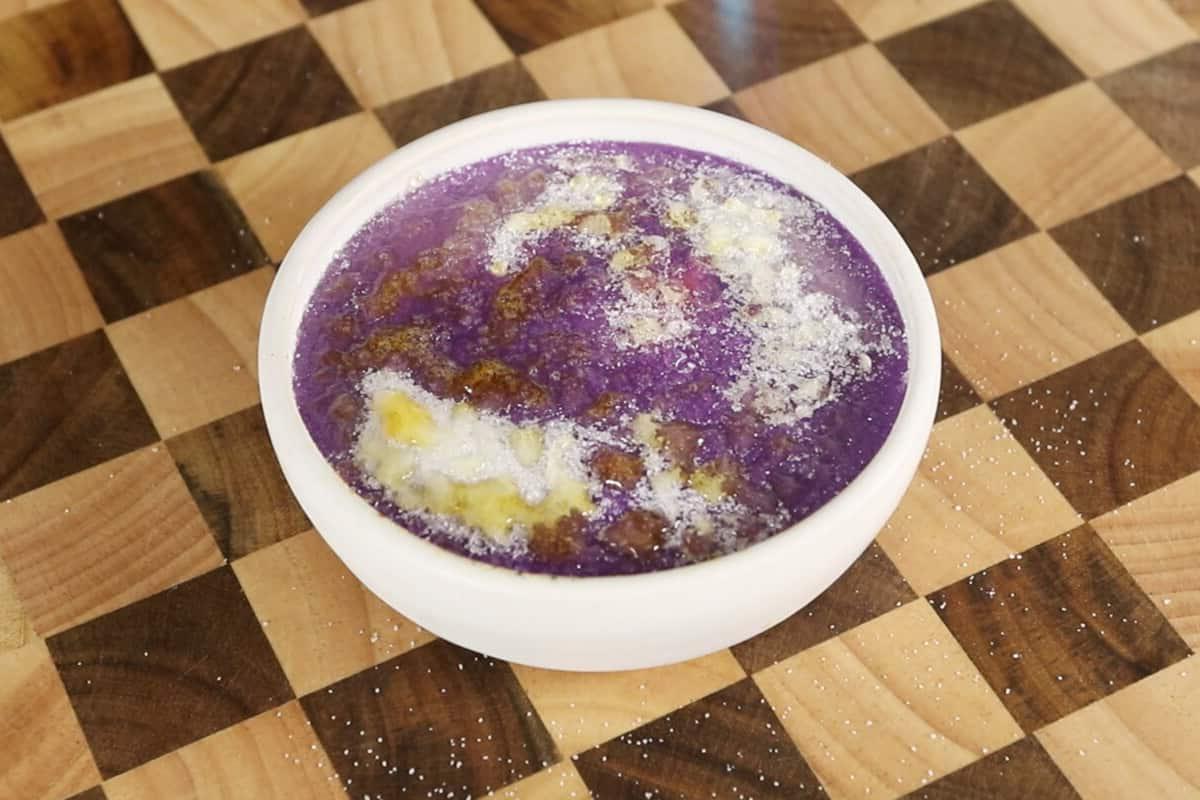 caramelizing the sugar on the ube creme brulee with a torch