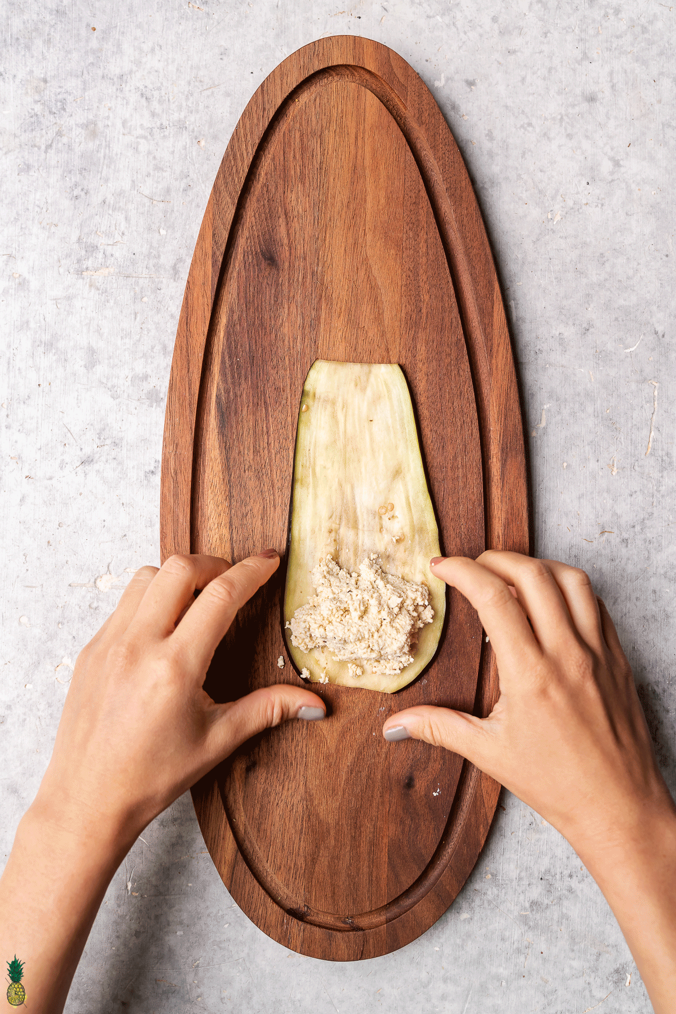 single eggplant thinly sliced with vegan ricotta cheese shot from over head