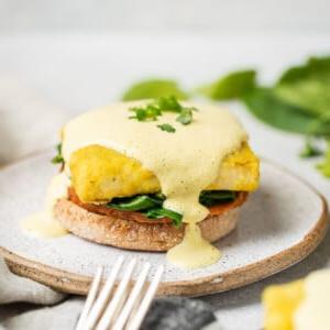 A close up shot of Vegan Eggs Benedict with Hollandaise