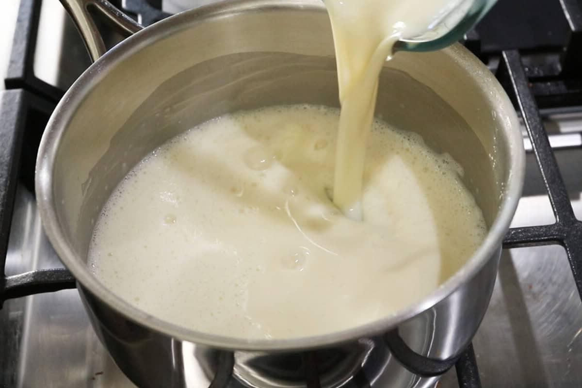 pouring milk into a pot