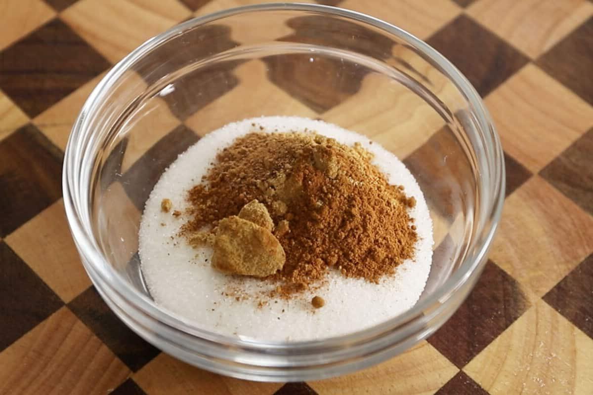 mixing sugar and spices for vegan pumpkin sugar cookies
