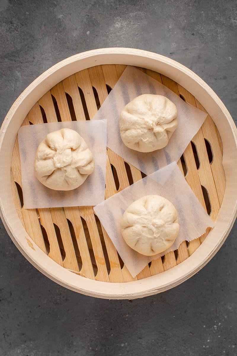 raw siopao asado in steamer