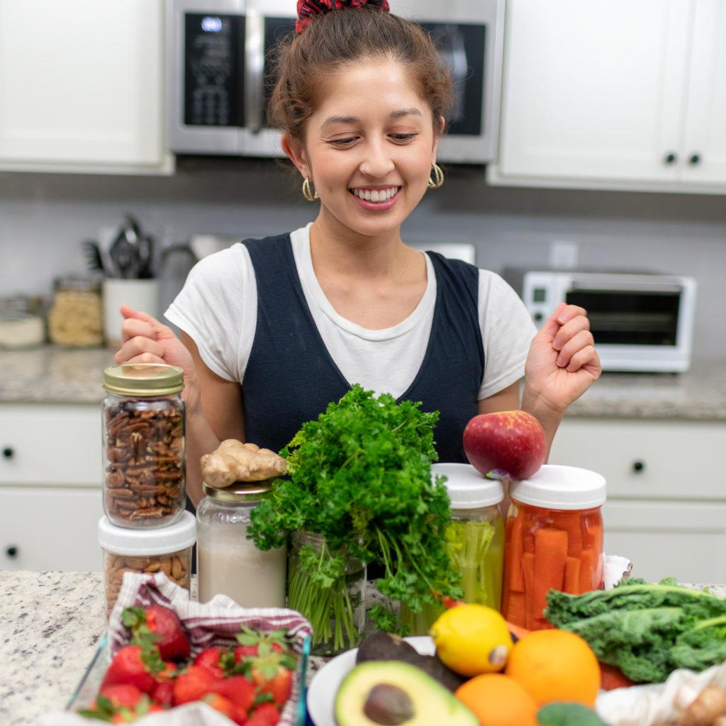 Jasmine in kitchen with fresh produce on the counter and tips on storage