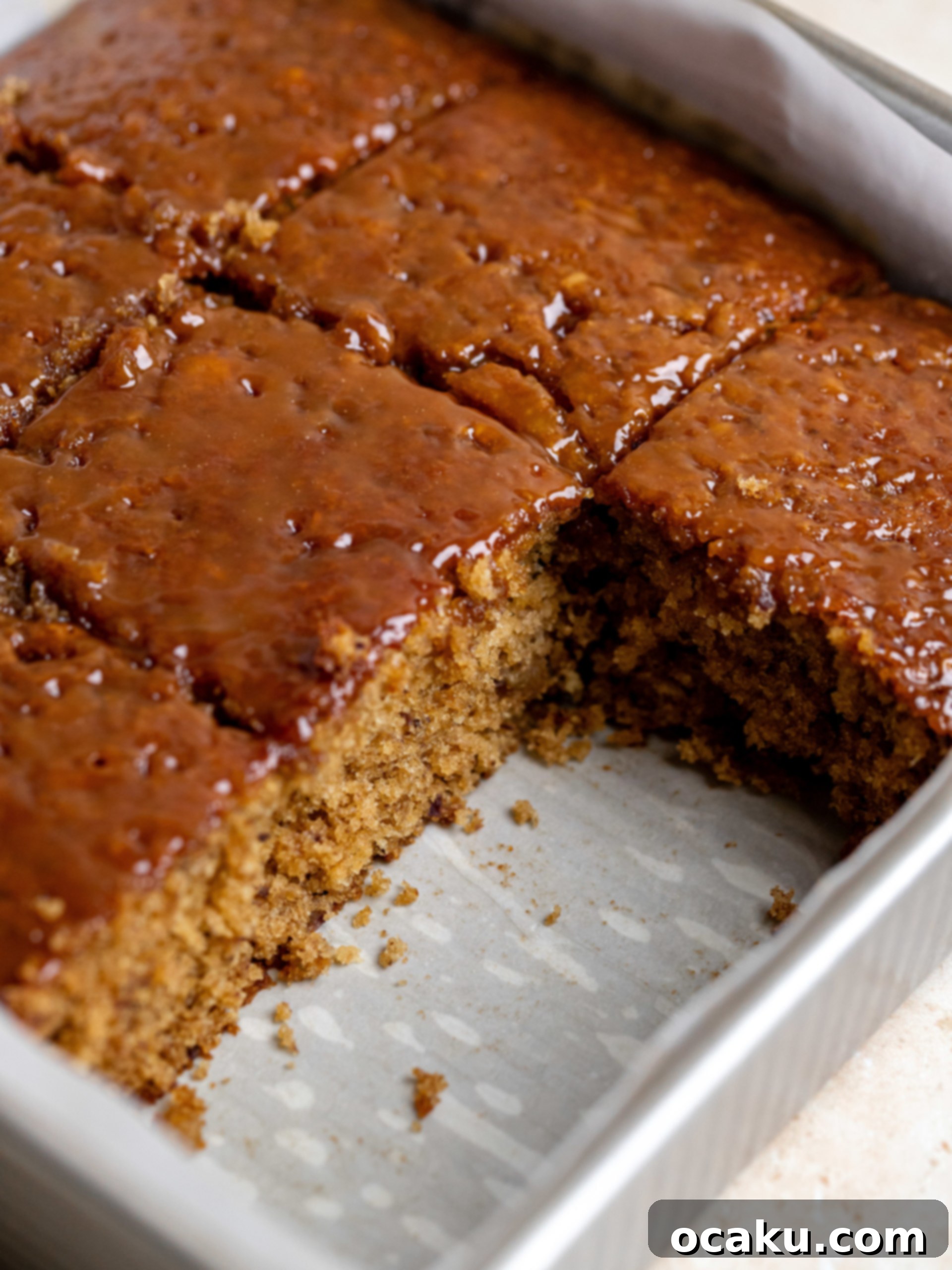 Toffee sauce poured over the warm cake