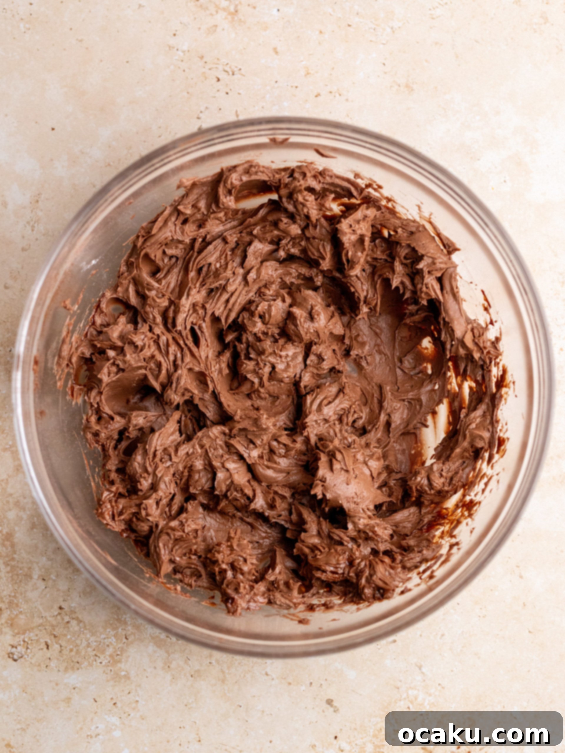 Whipped heavy cream being prepared in a stand mixer.