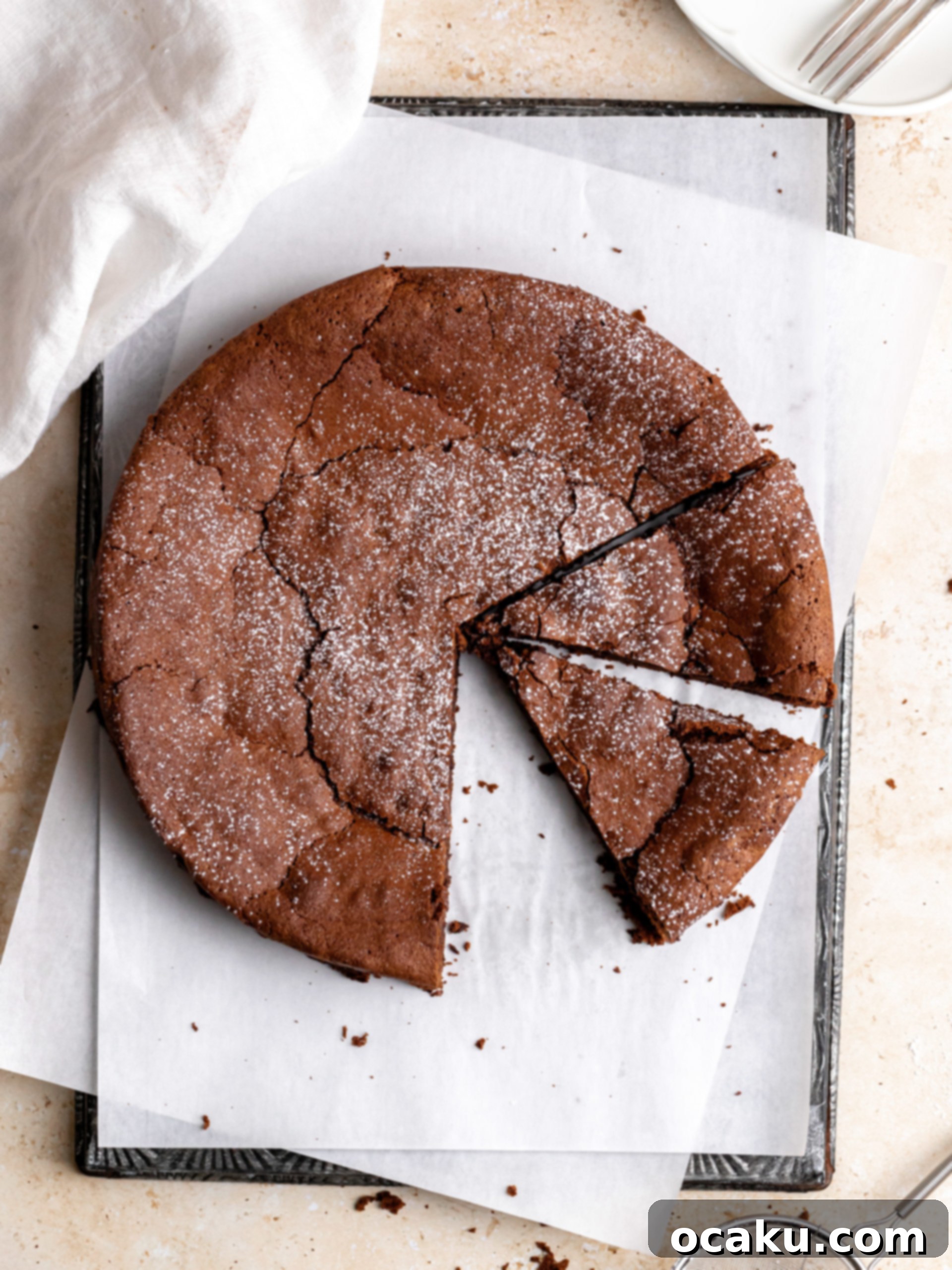 A perfectly baked Flourless Chocolate Espresso Cake cooling on a wire rack.