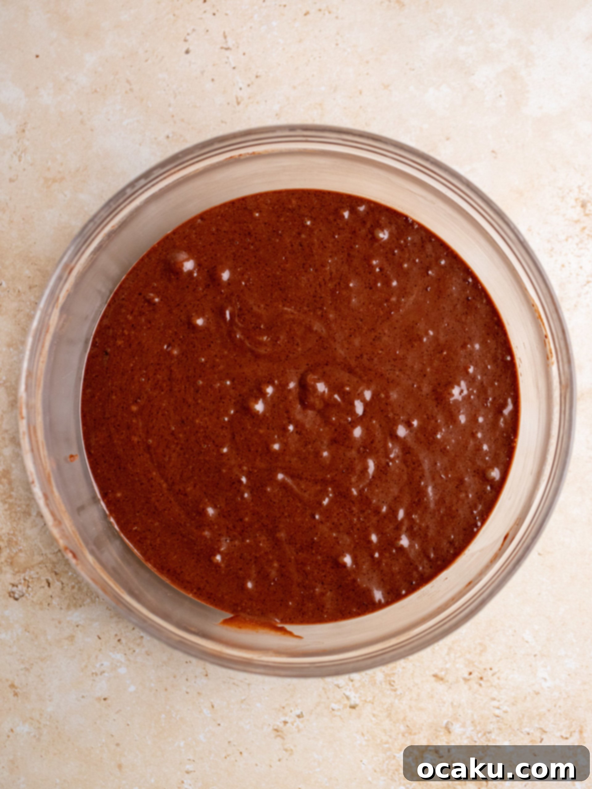 Mixing wet and dry ingredients gently.