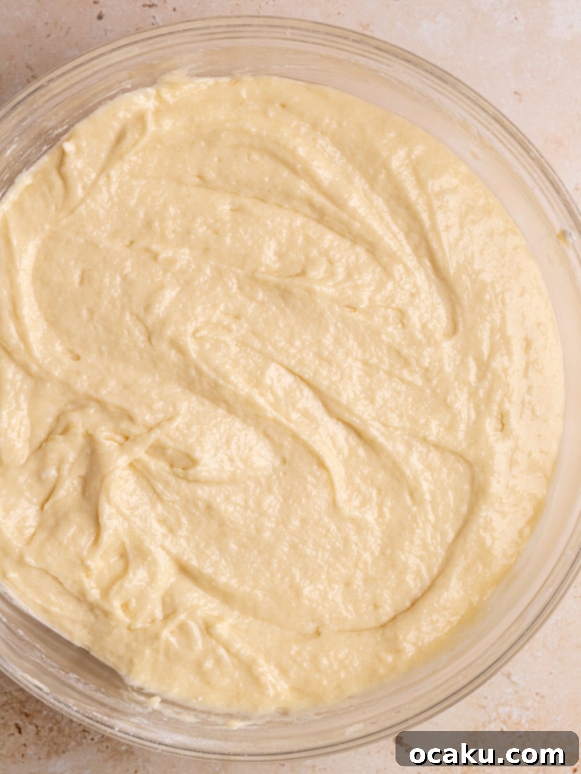 Vanilla cake batter in a mixing bowl.