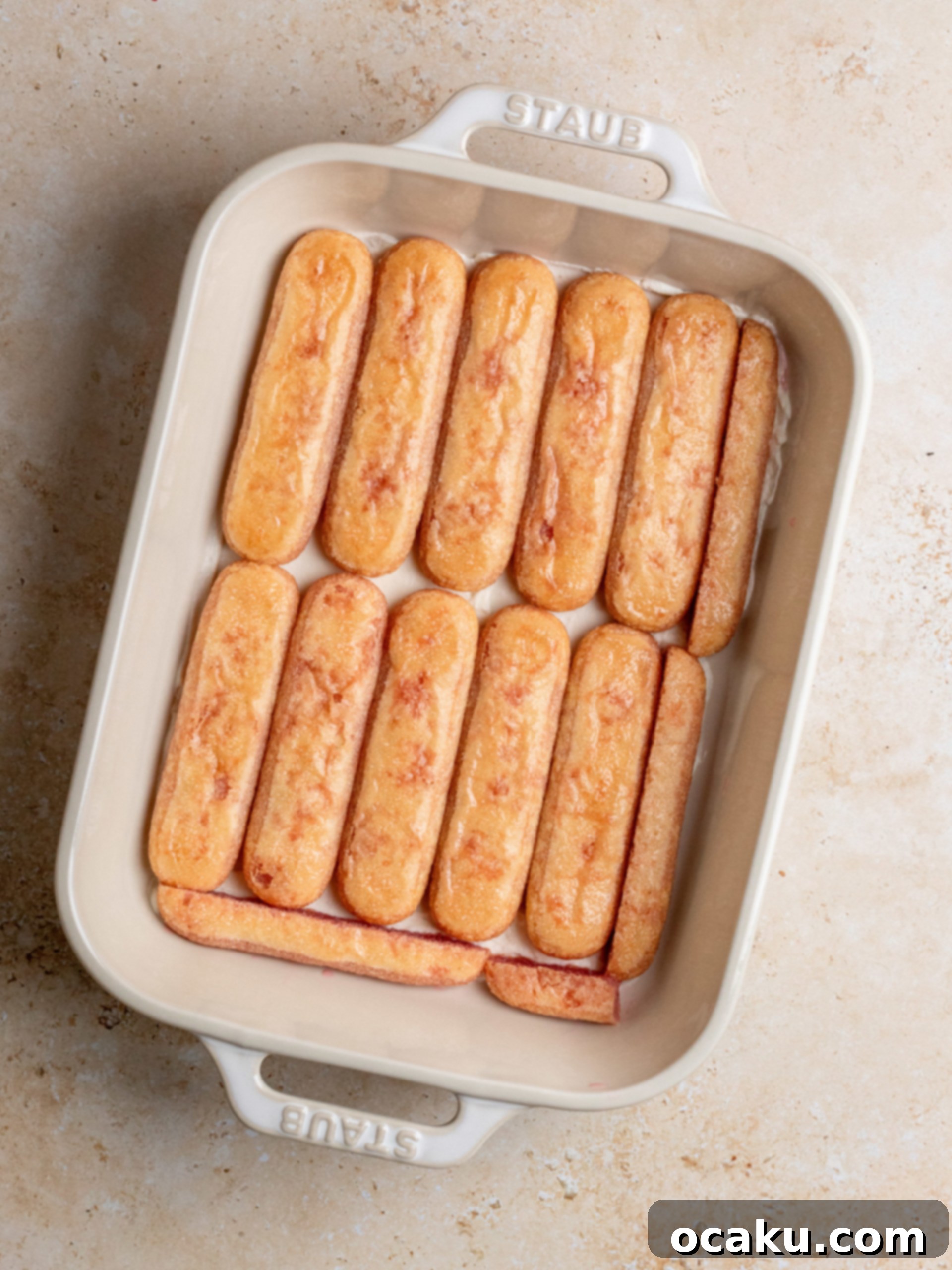 Raspberry Dream Tiramisu 6 The finished raspberry syrup, clear and vibrant, in a small bowl, ready for use.