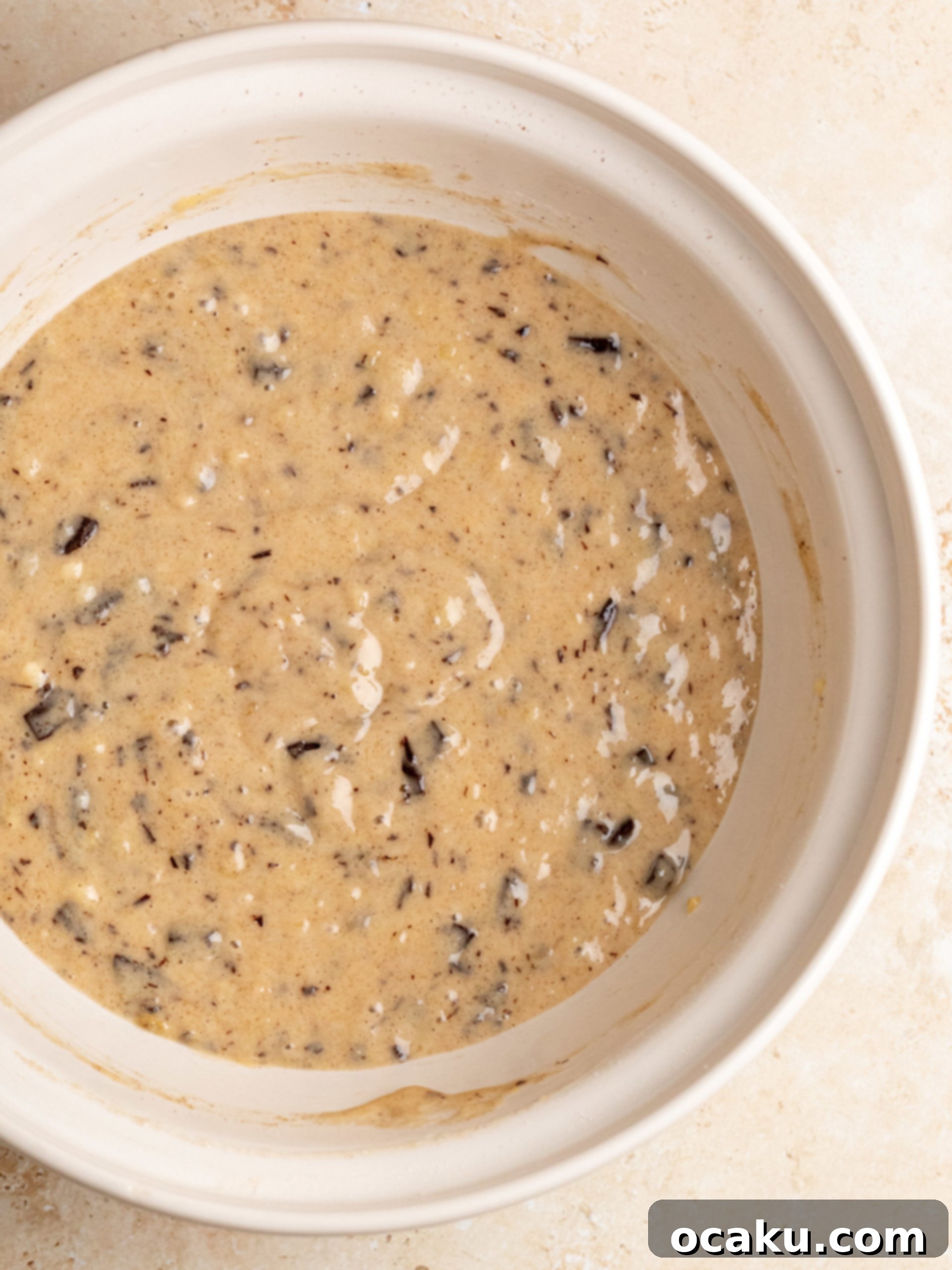 Effortless One-Bowl Banana Bread 3 Mixing the banana bread batter in a bowl.