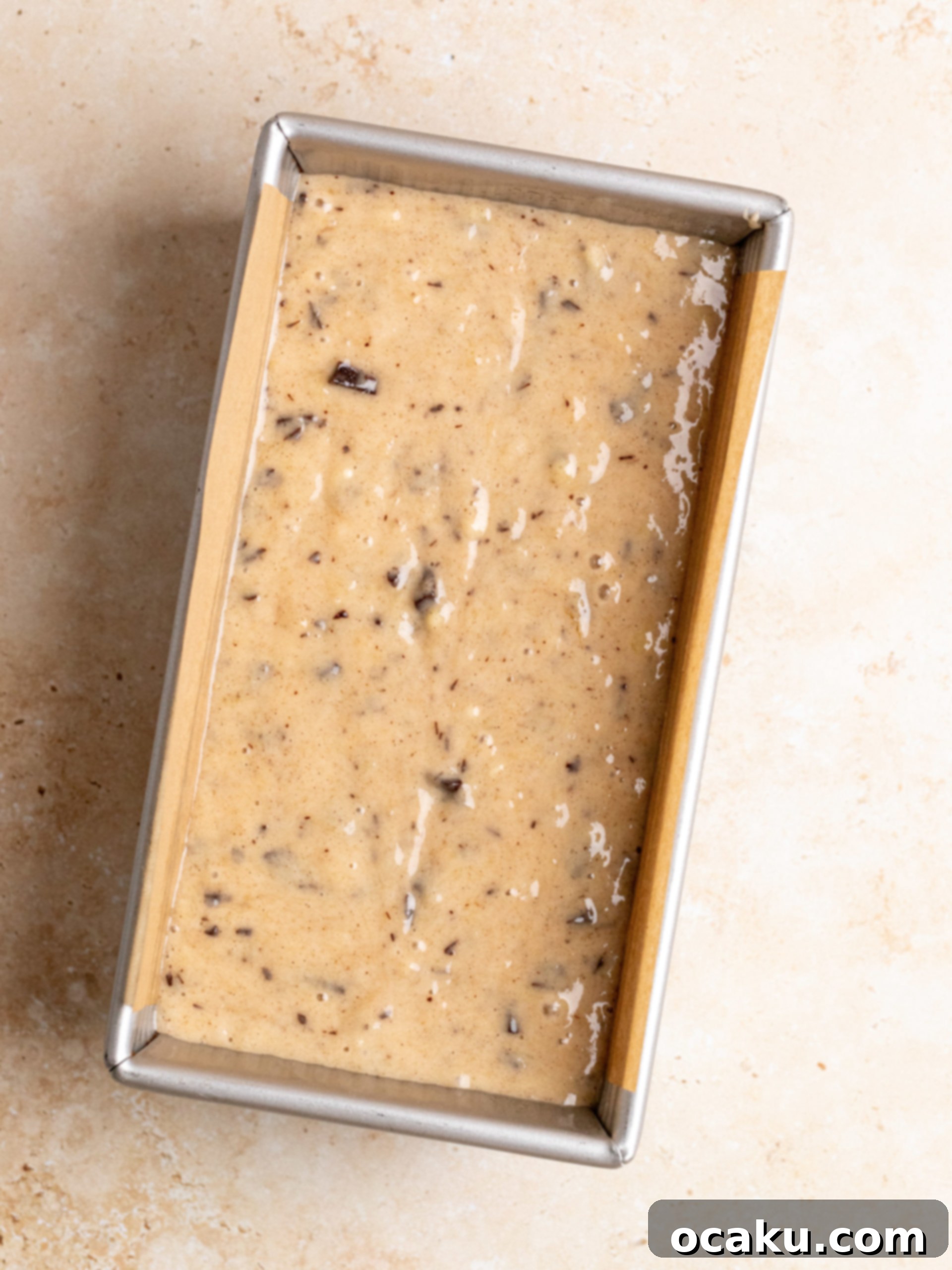 Effortless One-Bowl Banana Bread 4 Adding chocolate chips to the banana bread batter.