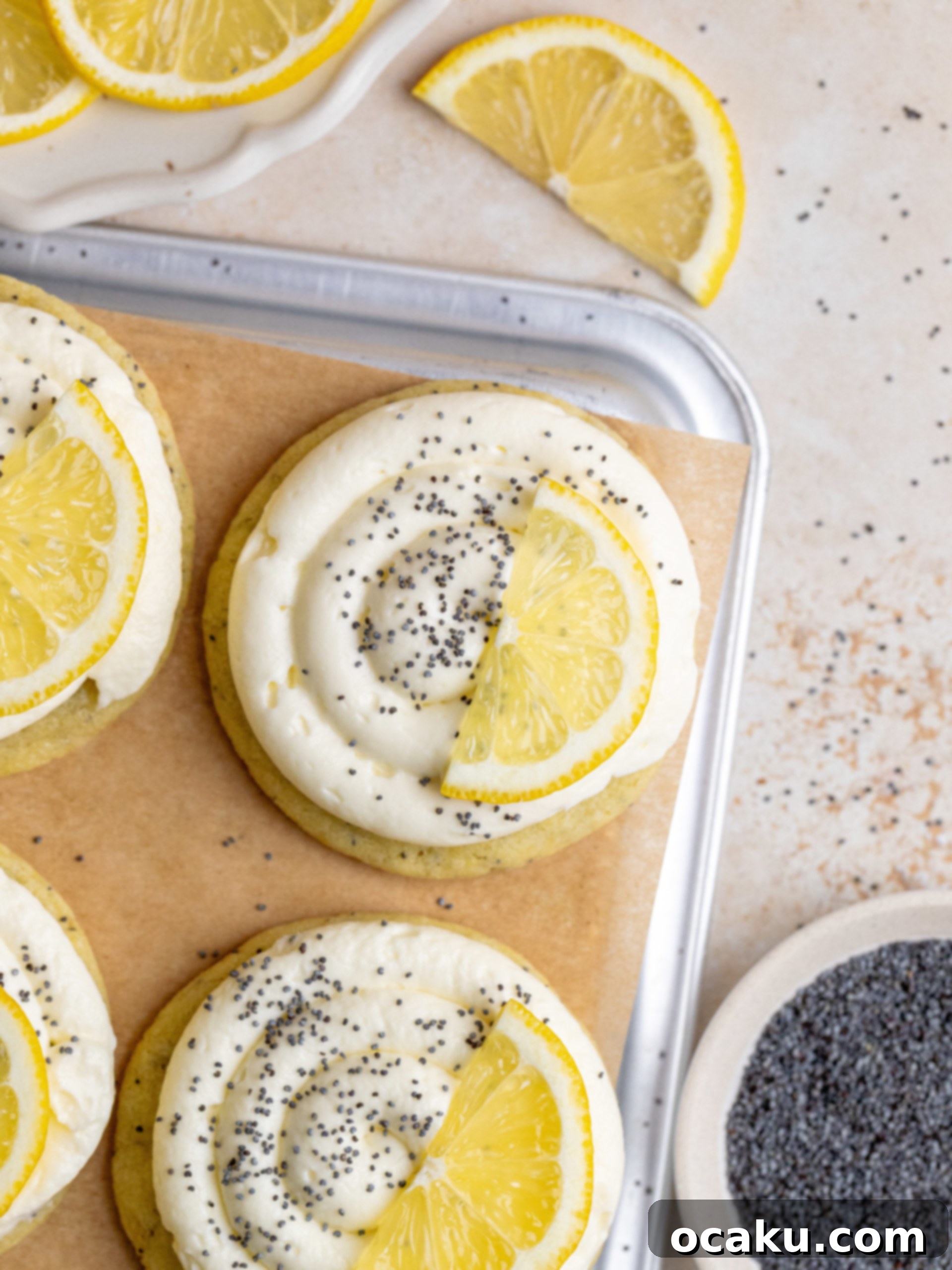 Freshly baked Lemon Poppy Seed Cookies with a luscious cheesecake frosting swirl