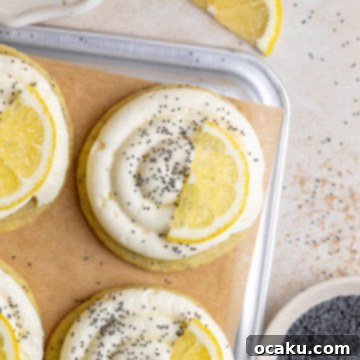 Lemon Poppy Seed Cheesecake Cookies with a swirl of cream cheese frosting and poppy seeds