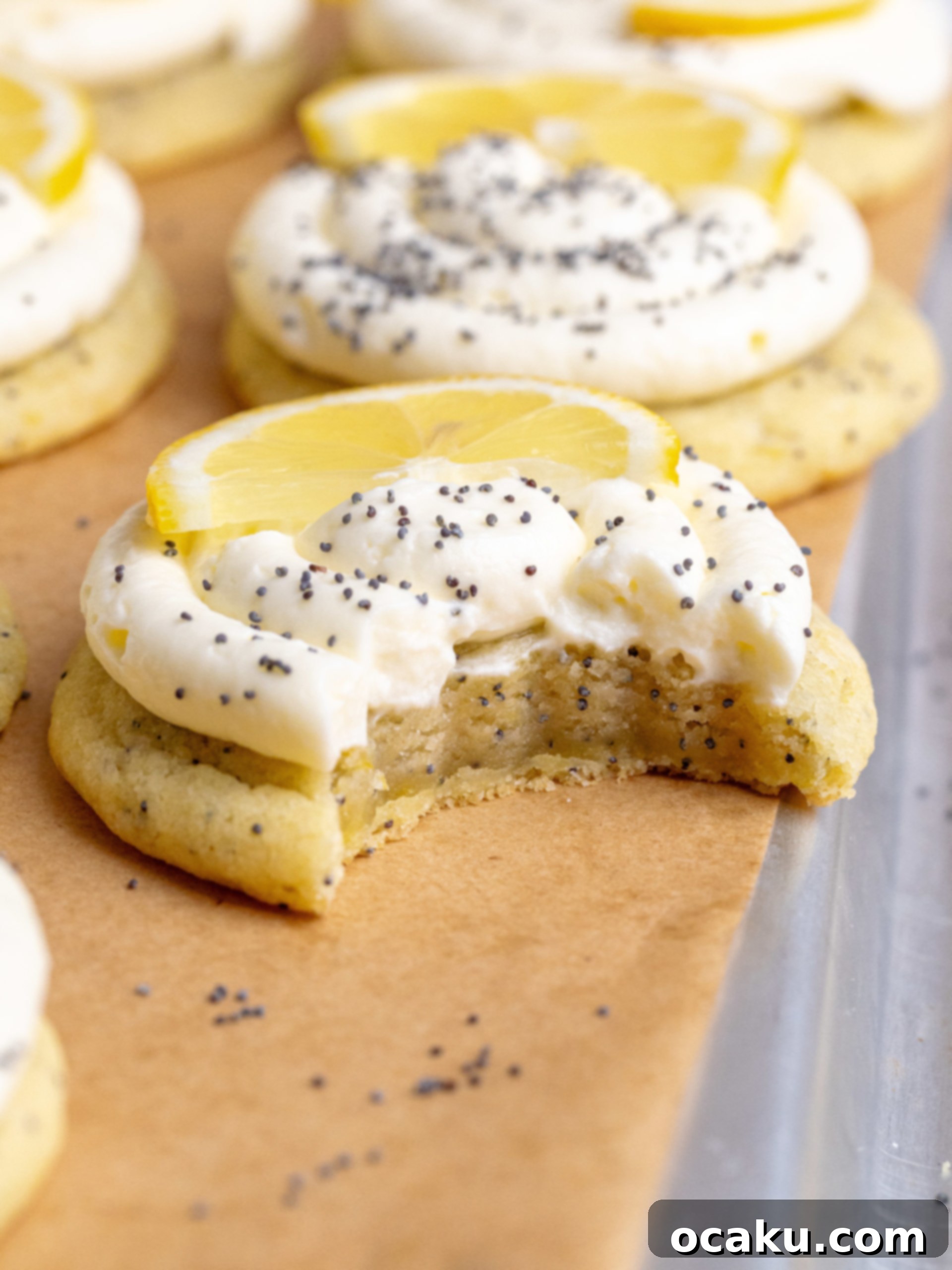 Lemon Poppy Seed Cheesecake Cookies with a swirl of cream cheese frosting and poppy seeds