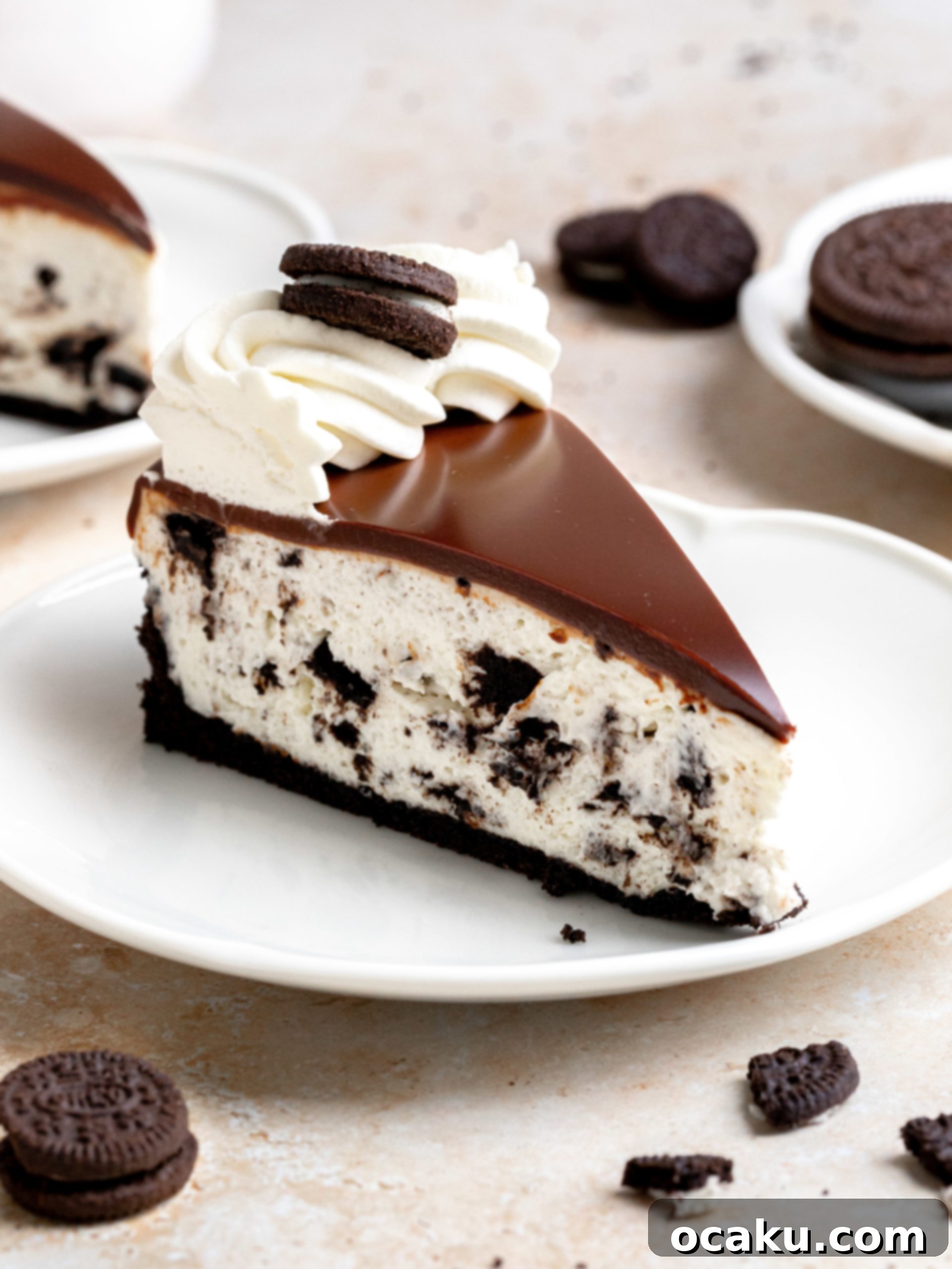 Easy No-Bake Oreo Cheesecake 9 A large slice of No-Bake Oreo Cheesecake on a plate, showing the layers and creamy texture.
