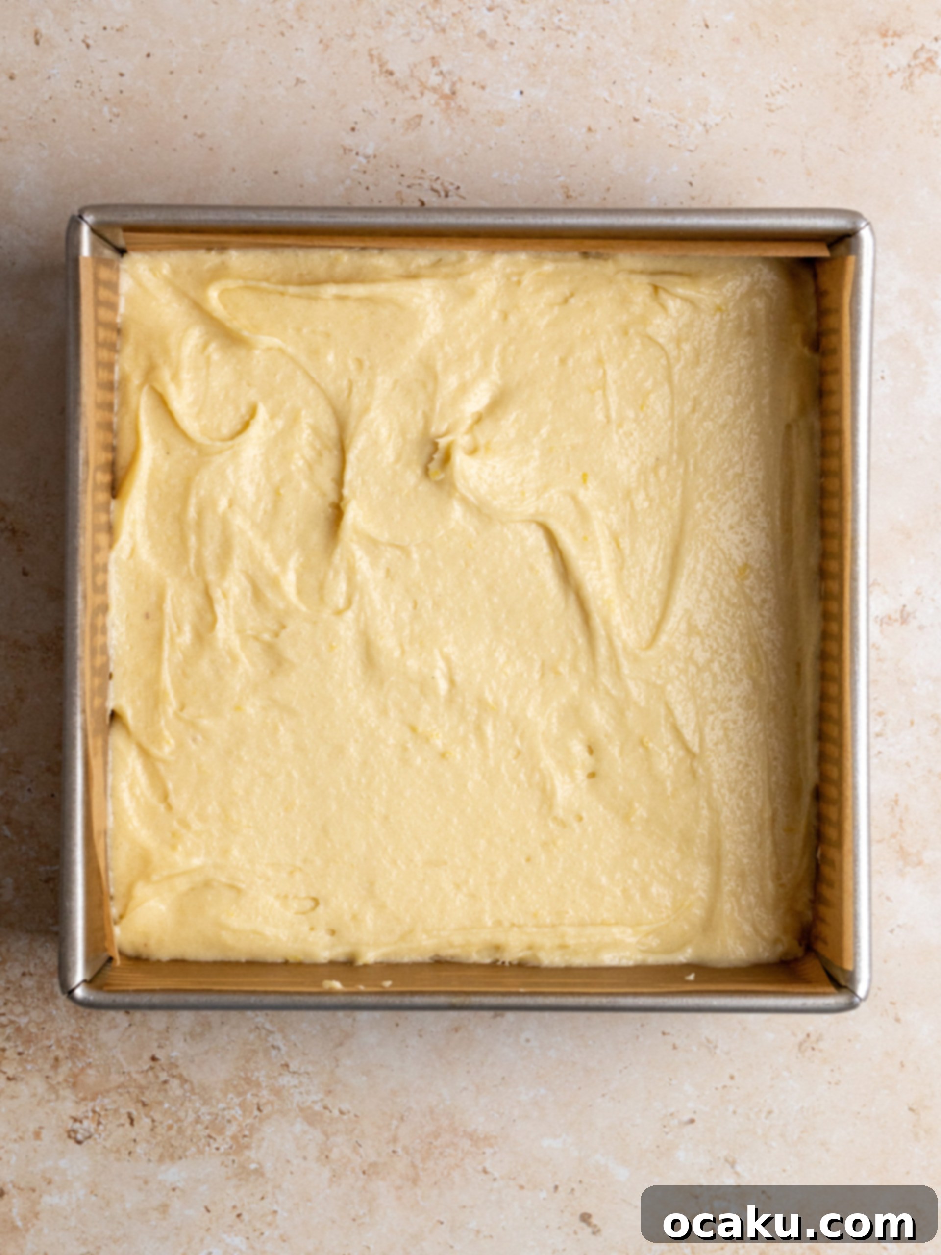 Zesty Lemon Fudge Squares 4 A baked lemon brownie, cooled on a wire rack.