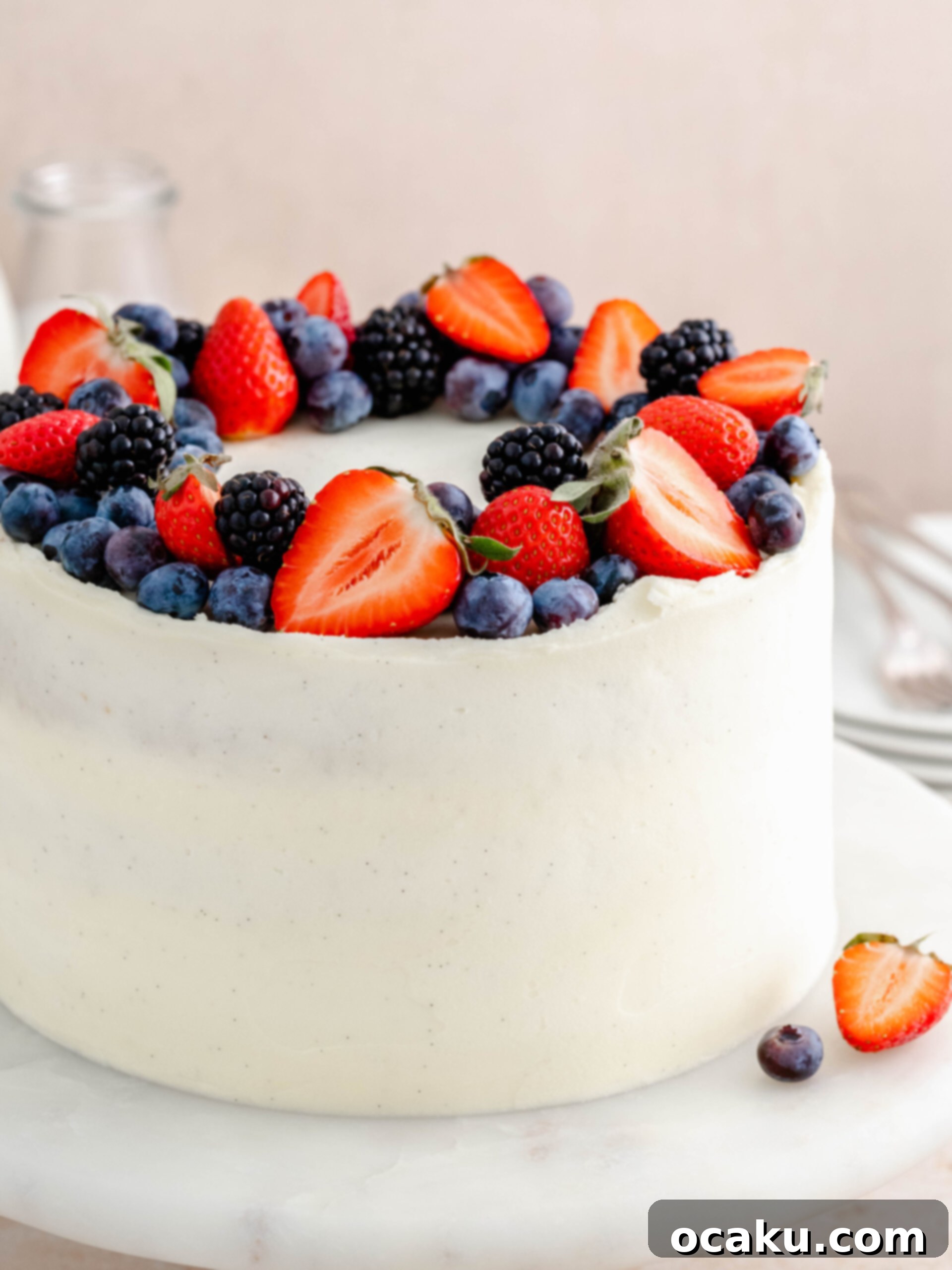 Ingredients for strawberry and blueberry layer cake, including fresh berries