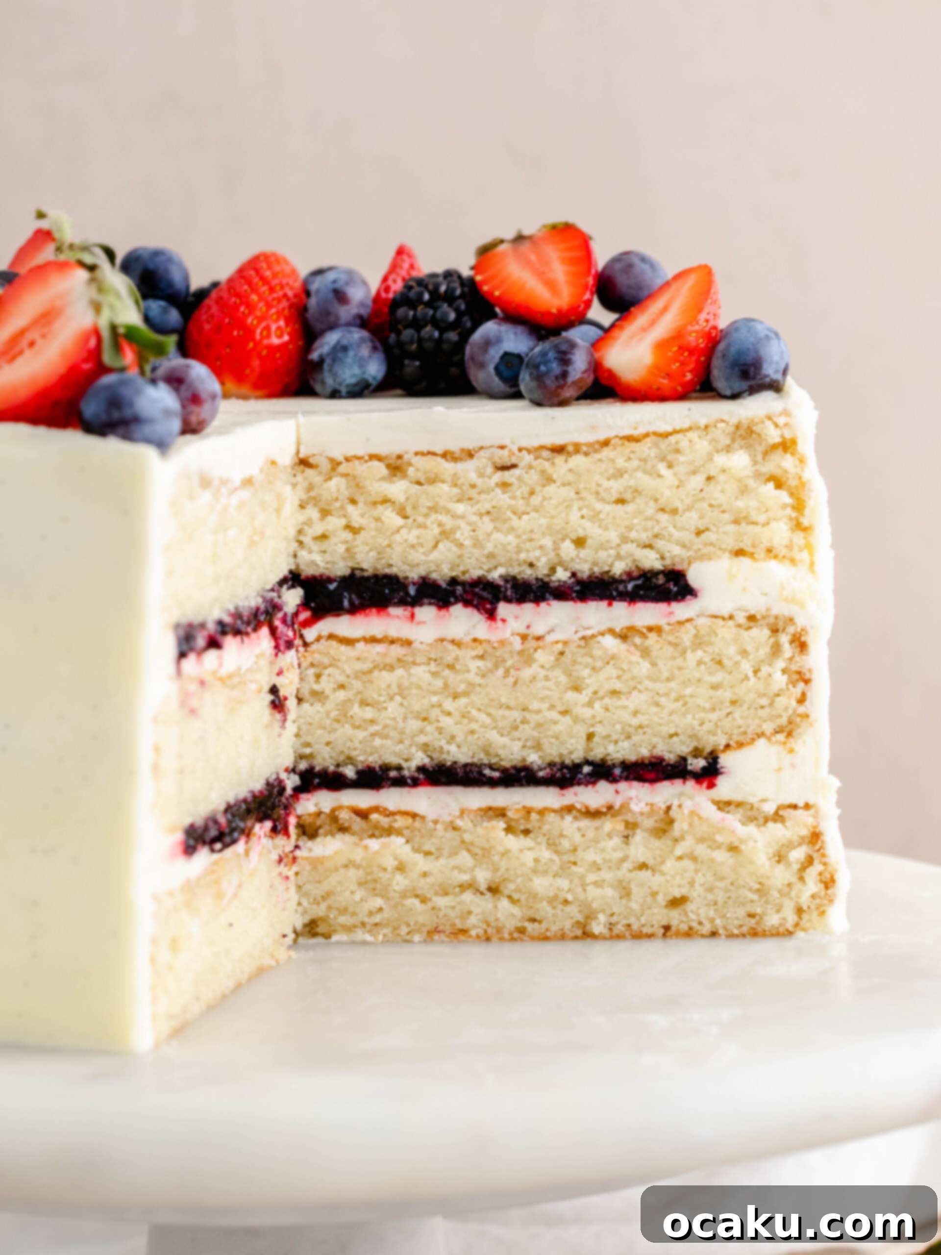 Cooking strawberry and blueberry compote in a pot