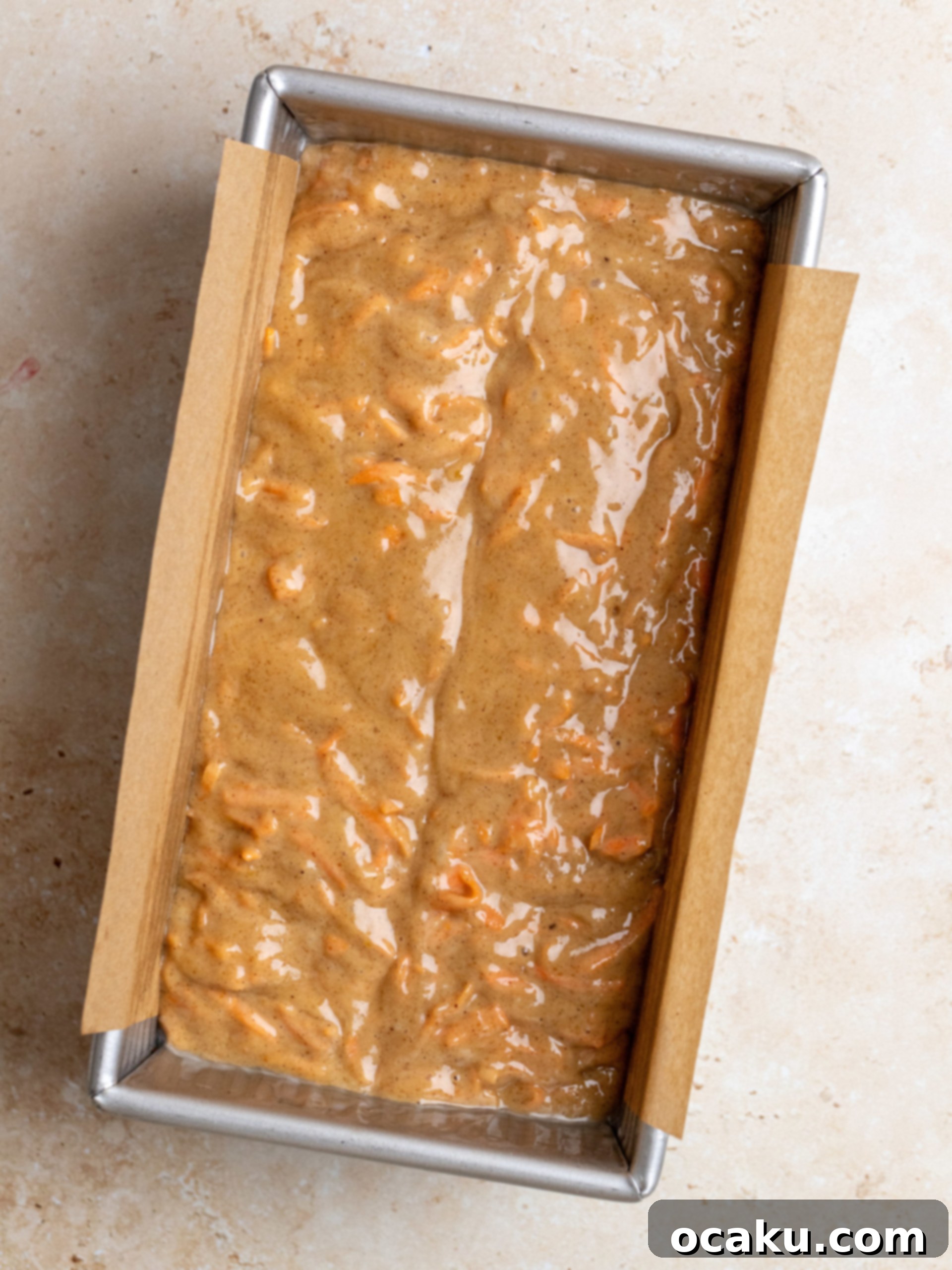 Spiced Carrot Loaf 5 Freshly grated carrots being folded into the cake batter.