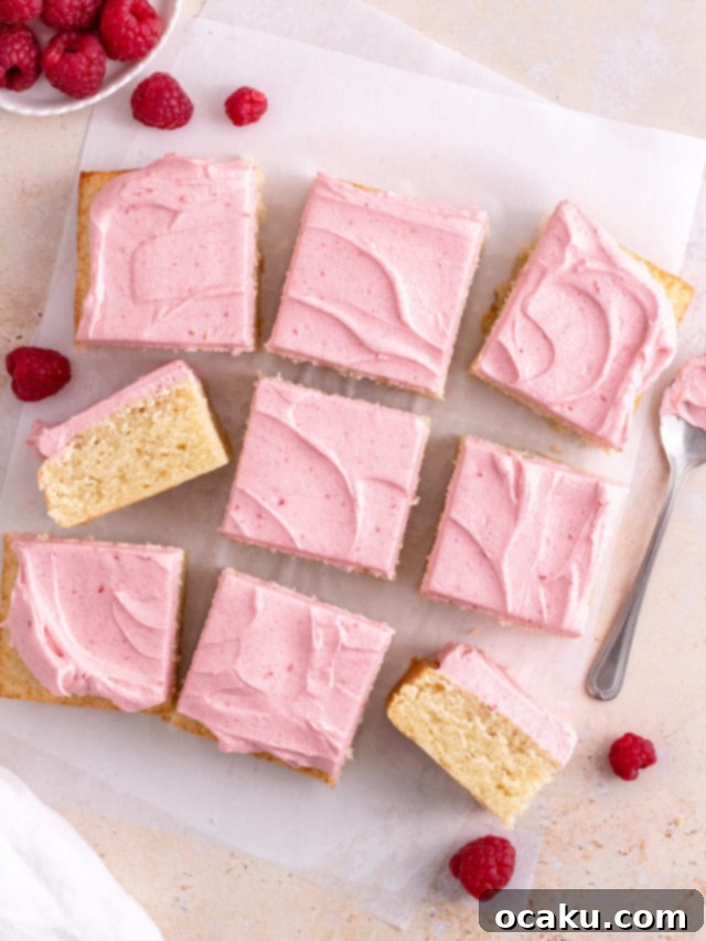 Delicate Almond Raspberry Cake with fluffy almond cake and raspberry buttercream.