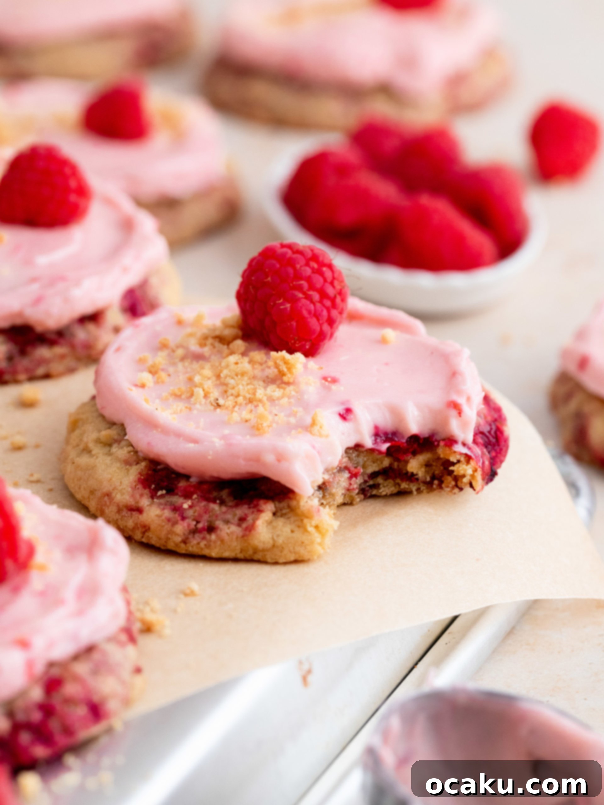 Delicious Raspberry Cheesecake Cookies with graham cracker crumbs and cheesecake filling.