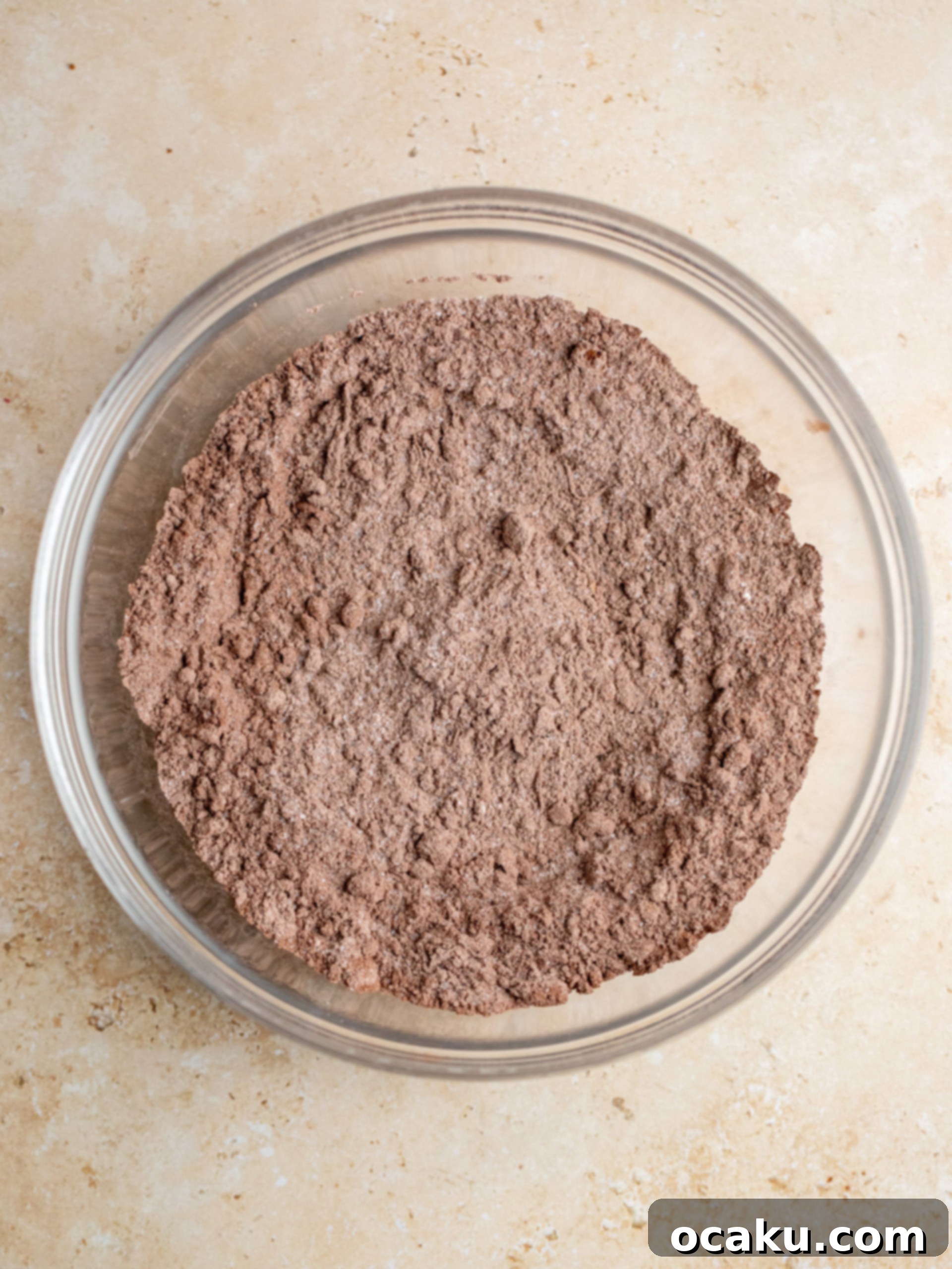 Dry ingredients for chocolate cupcakes in a mixing bowl.