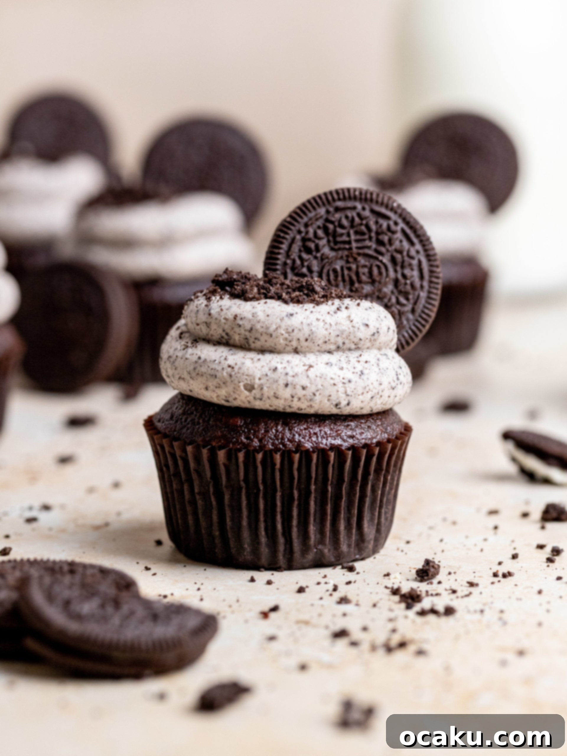 A top-down view of multiple frosted Oreo cupcakes, showcasing their decorative appeal and readiness for serving.