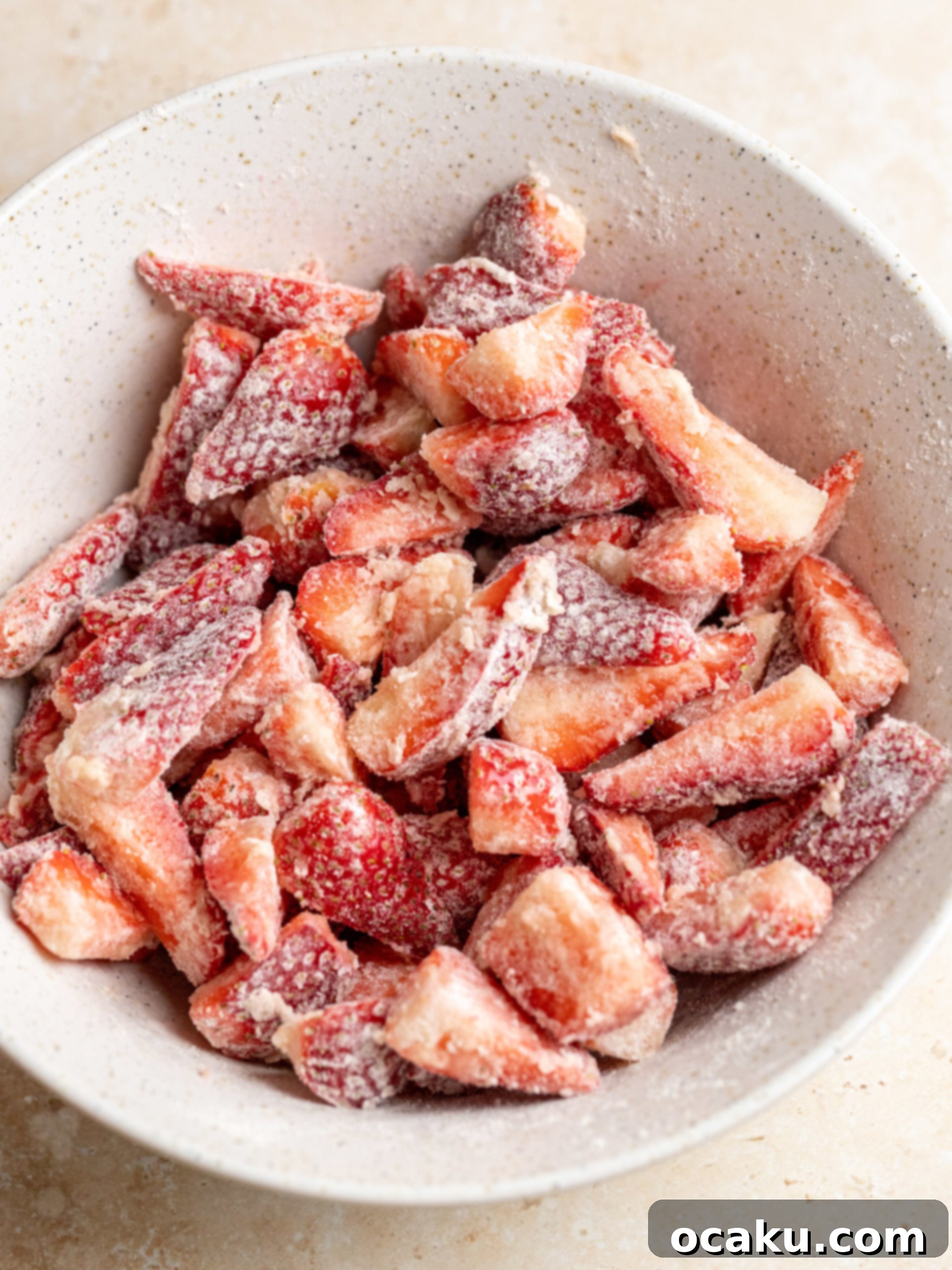 Strawberry Streusel Cake 5 Cake batter with strawberries being topped with crumble.