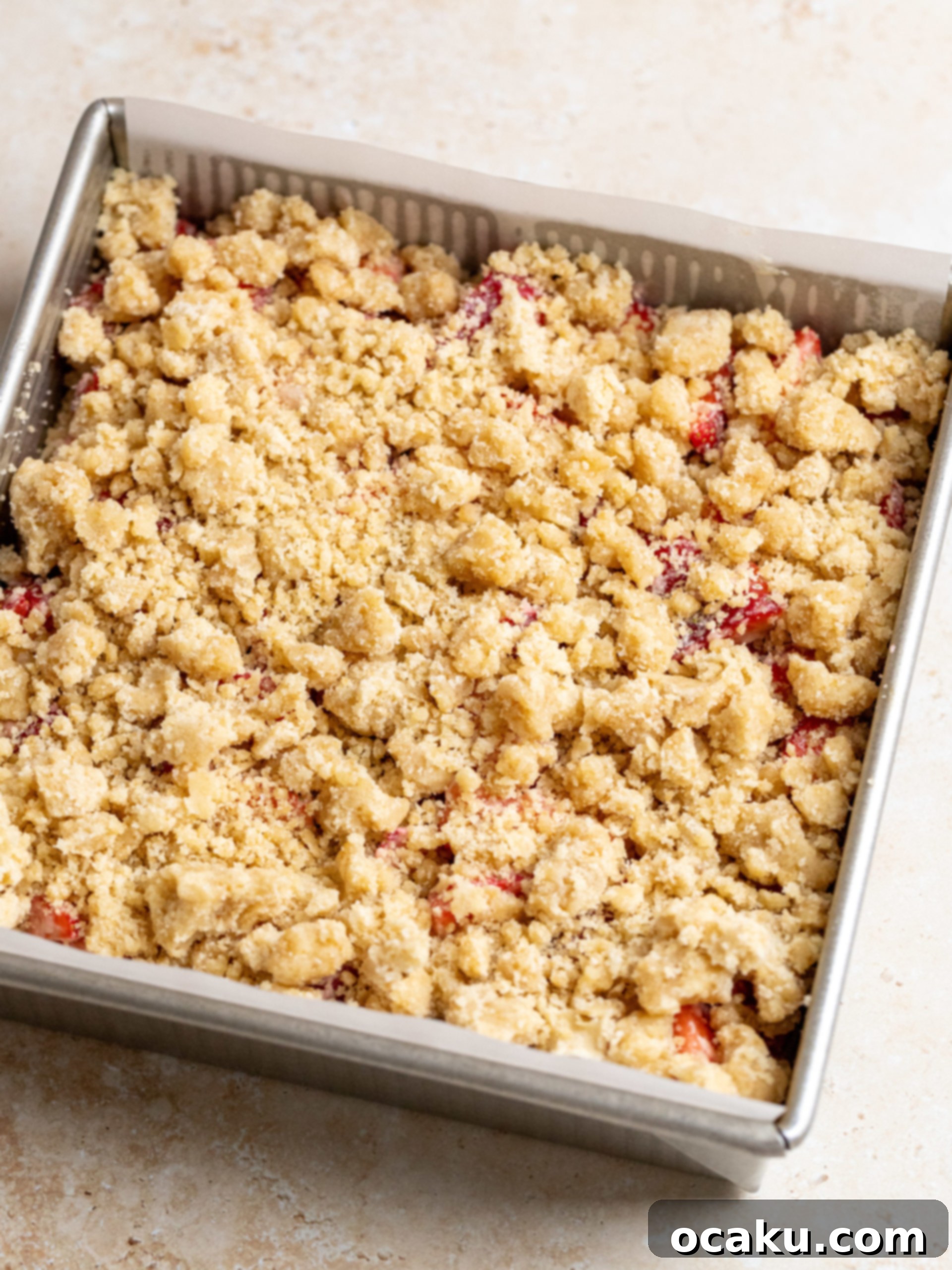 Strawberry Streusel Cake 6 Baked strawberry crumble cake fresh out of the oven, golden brown.