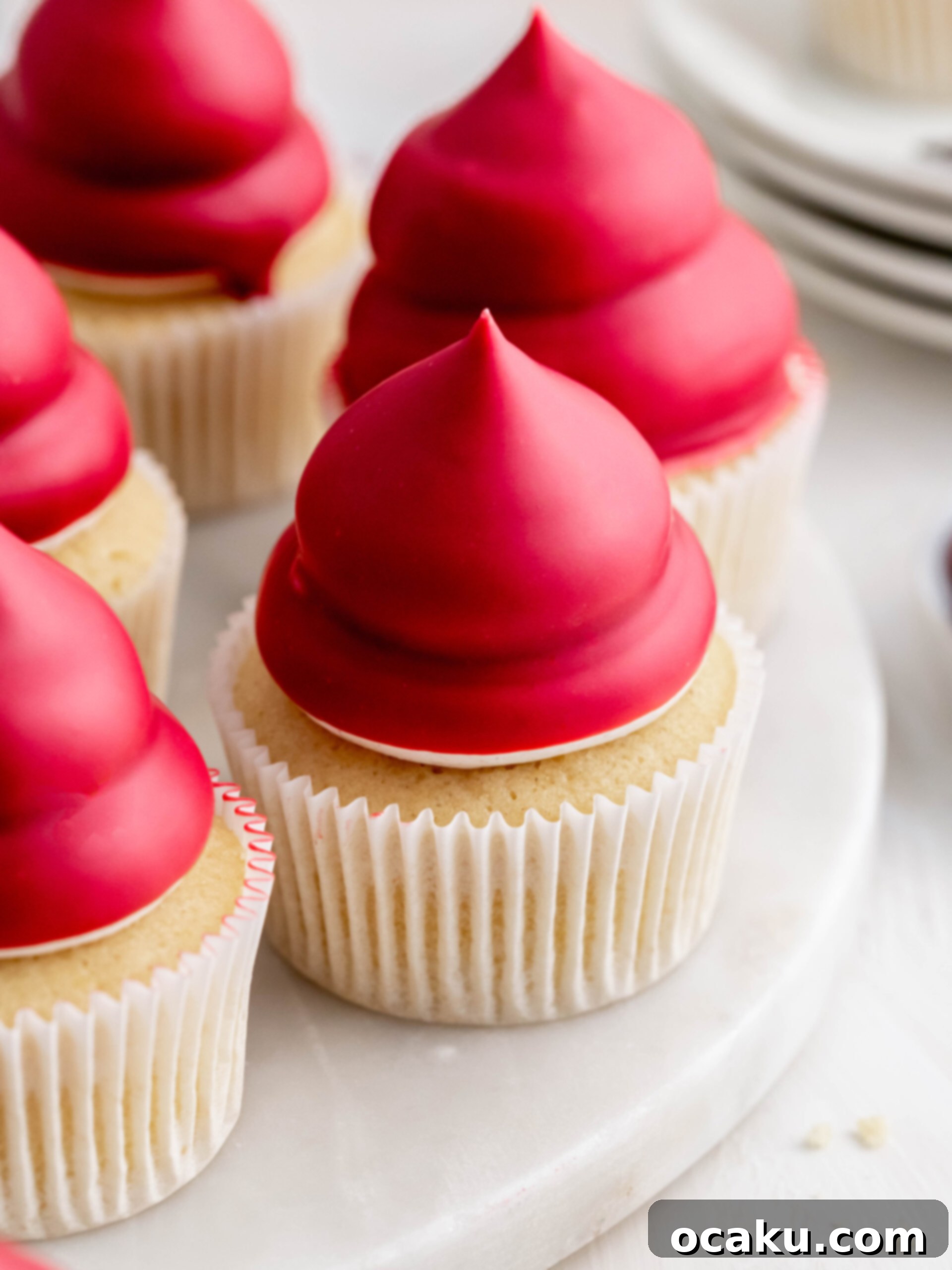 Raspberry Cream Puff Cupcakes arranged elegantly on a serving tray.