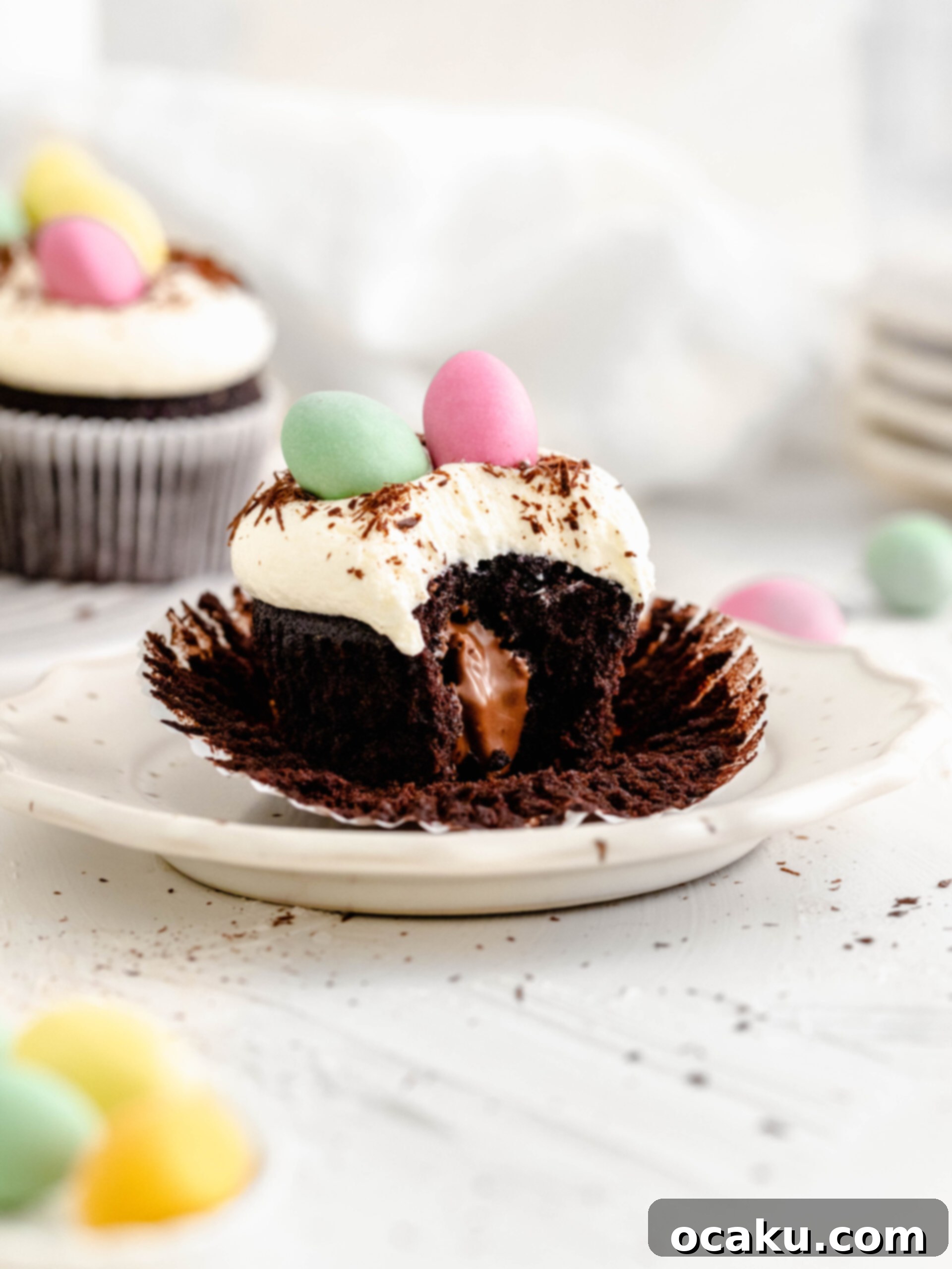 Easter Mini Egg Cupcakes 5 Mini egg chocolate cupcake on a plate, beautifully frosted and ready to be enjoyed as an Easter treat.