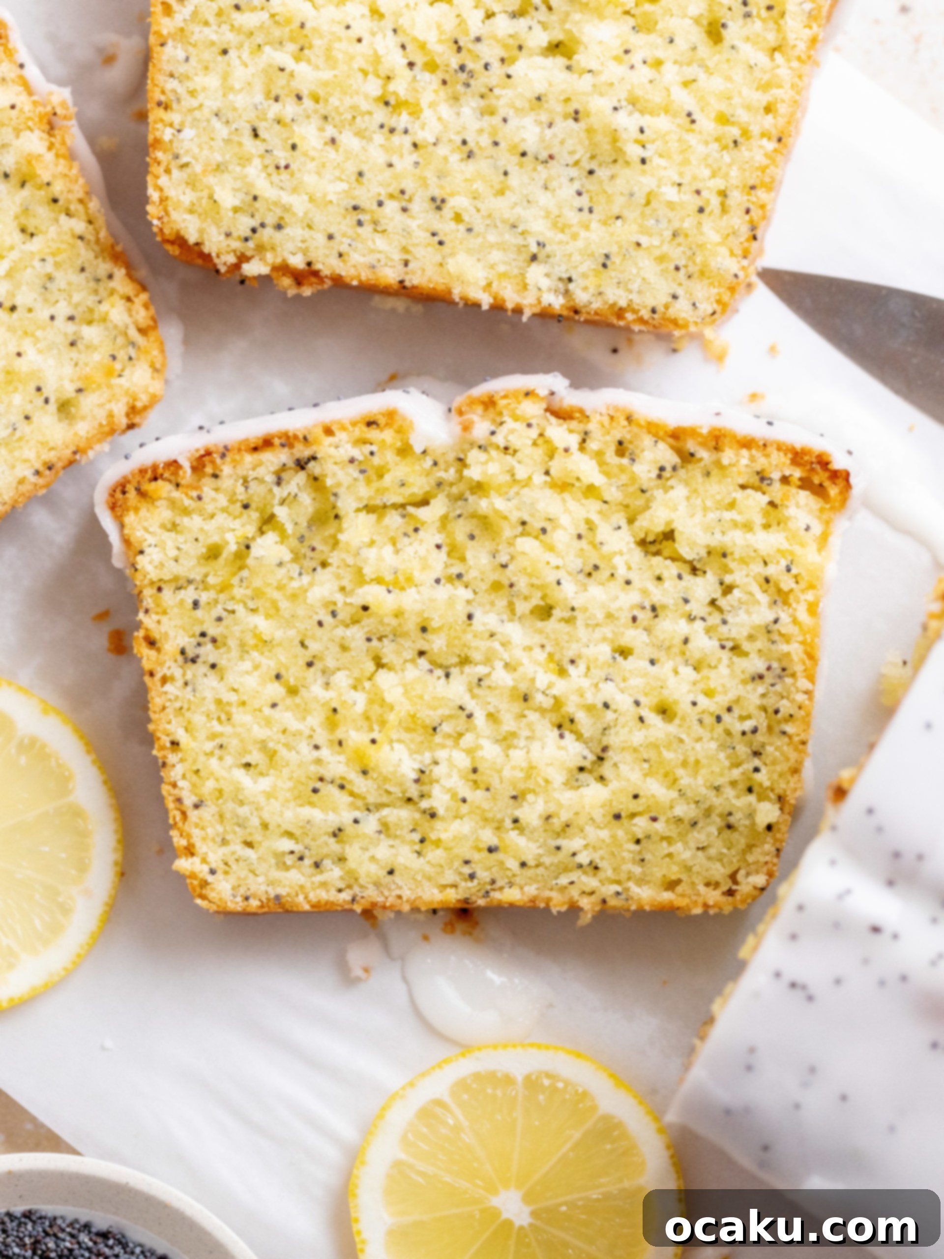 Slice of Lemon Poppy Seed Cake with lemon icing drizzle