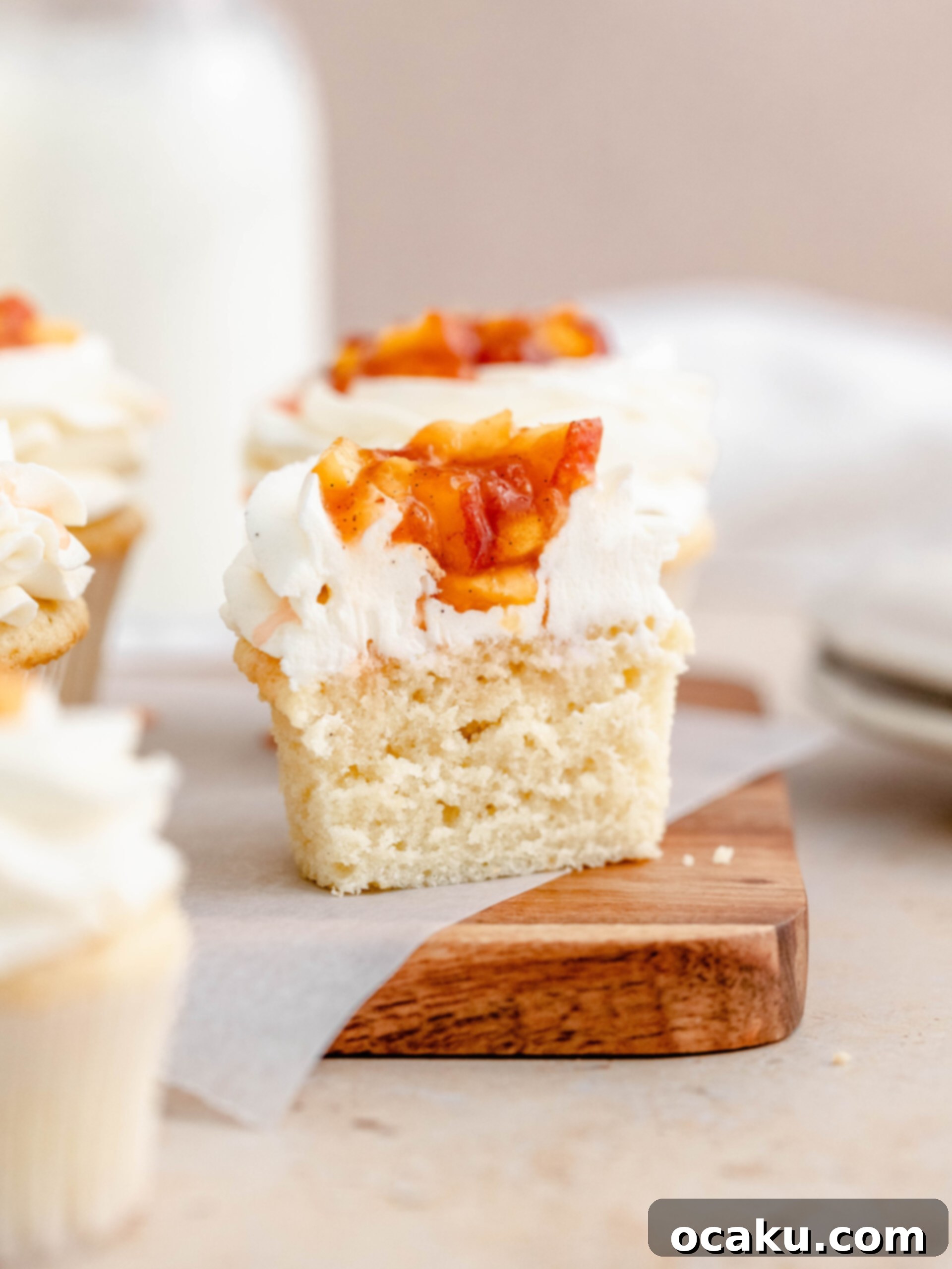 A soft vanilla cupcake, with a delicious vanilla buttercream and peach compote, presented beautifully.