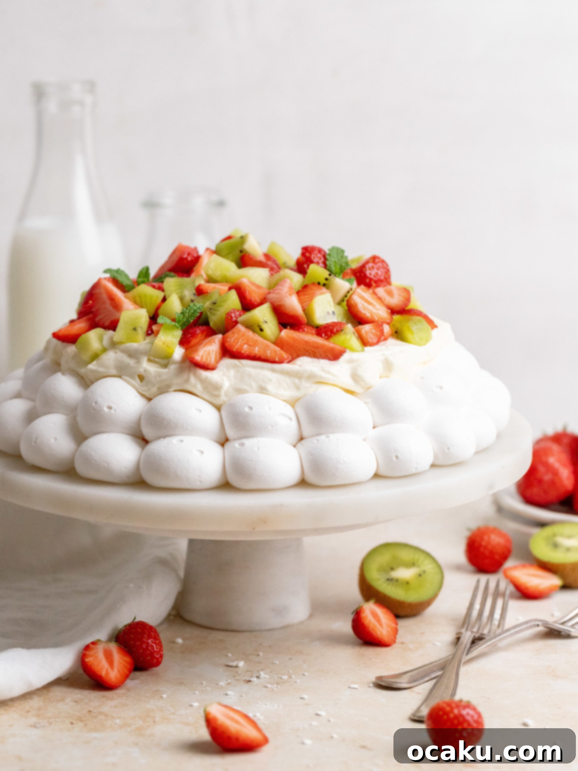 Close-up of the baked pavlova shell, showcasing its crisp texture and slight cracks, ready for cream and fruit