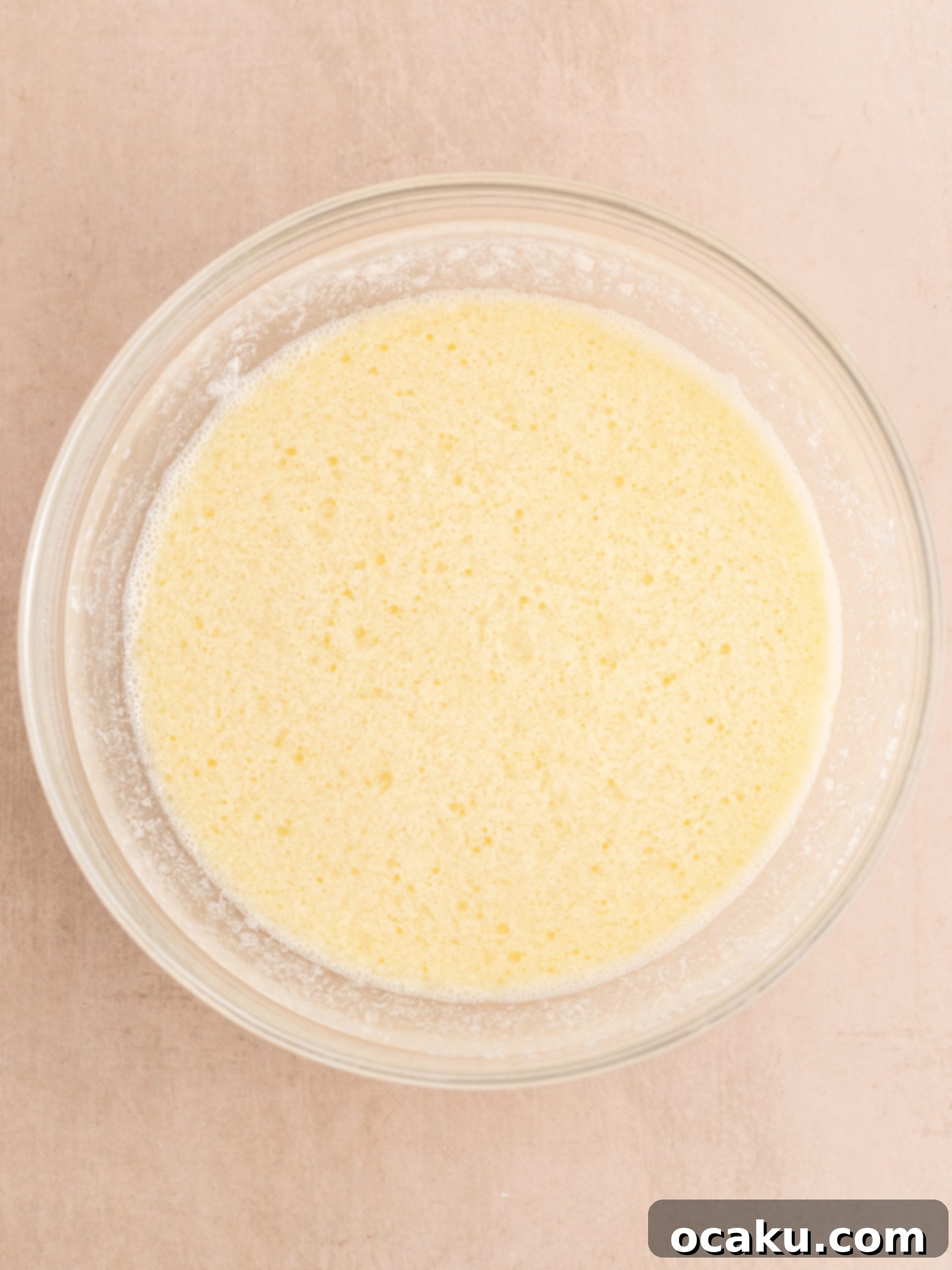 Mixing wet ingredients, including hot water, for chocolate cupcakes