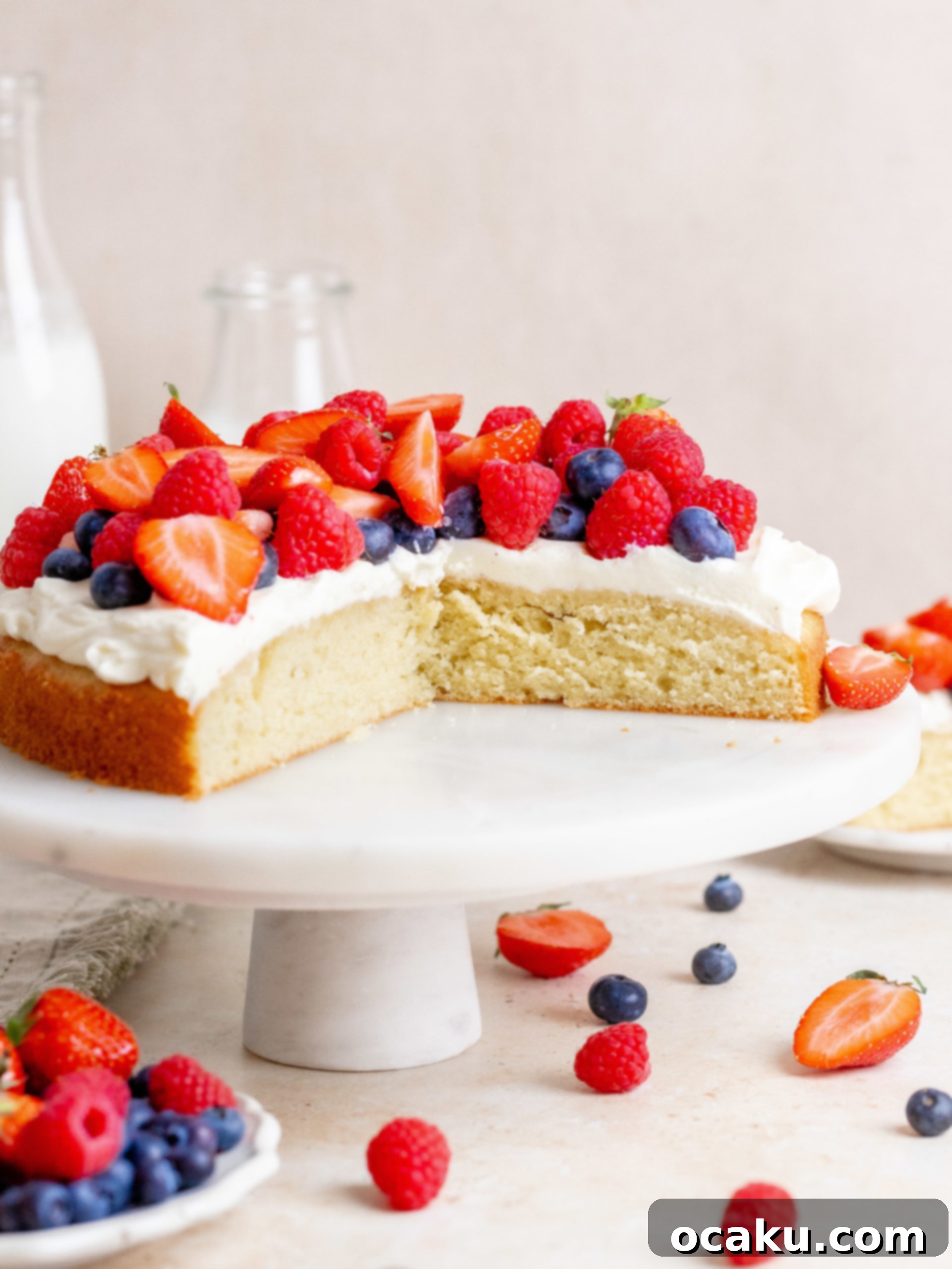 Fresh Berry Cream Cake with colorful berries on top