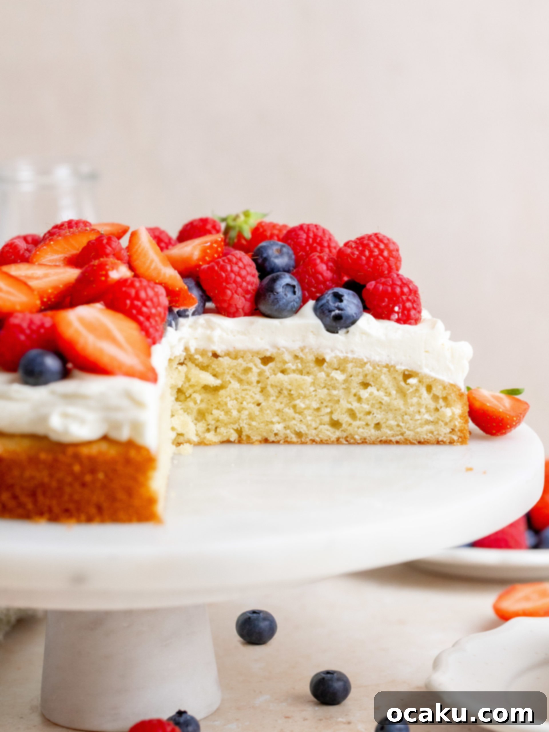 Fresh Berry Cream Cake on a wooden board