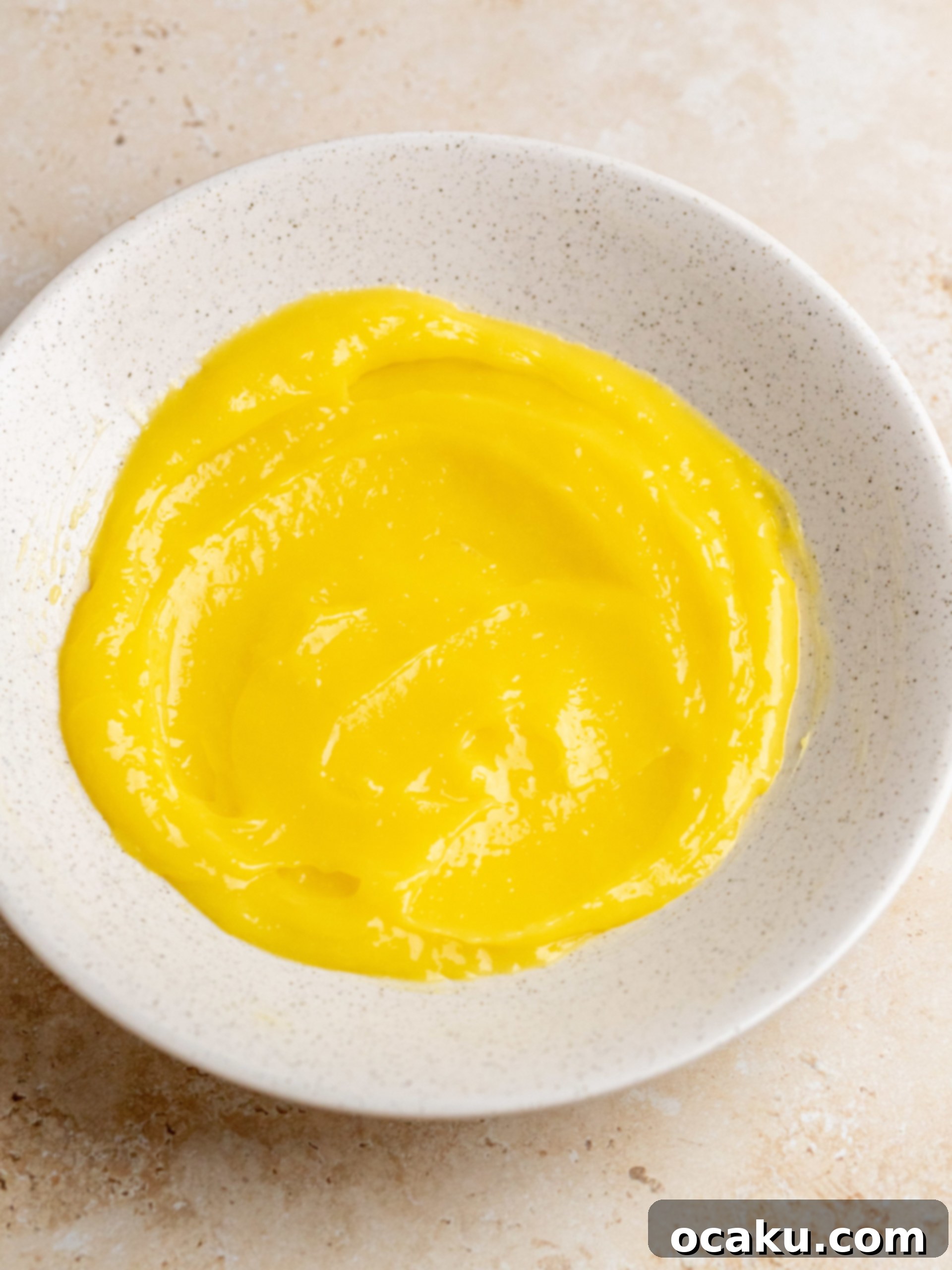 Limoncello Tiramisu ready to be topped with lemon curd