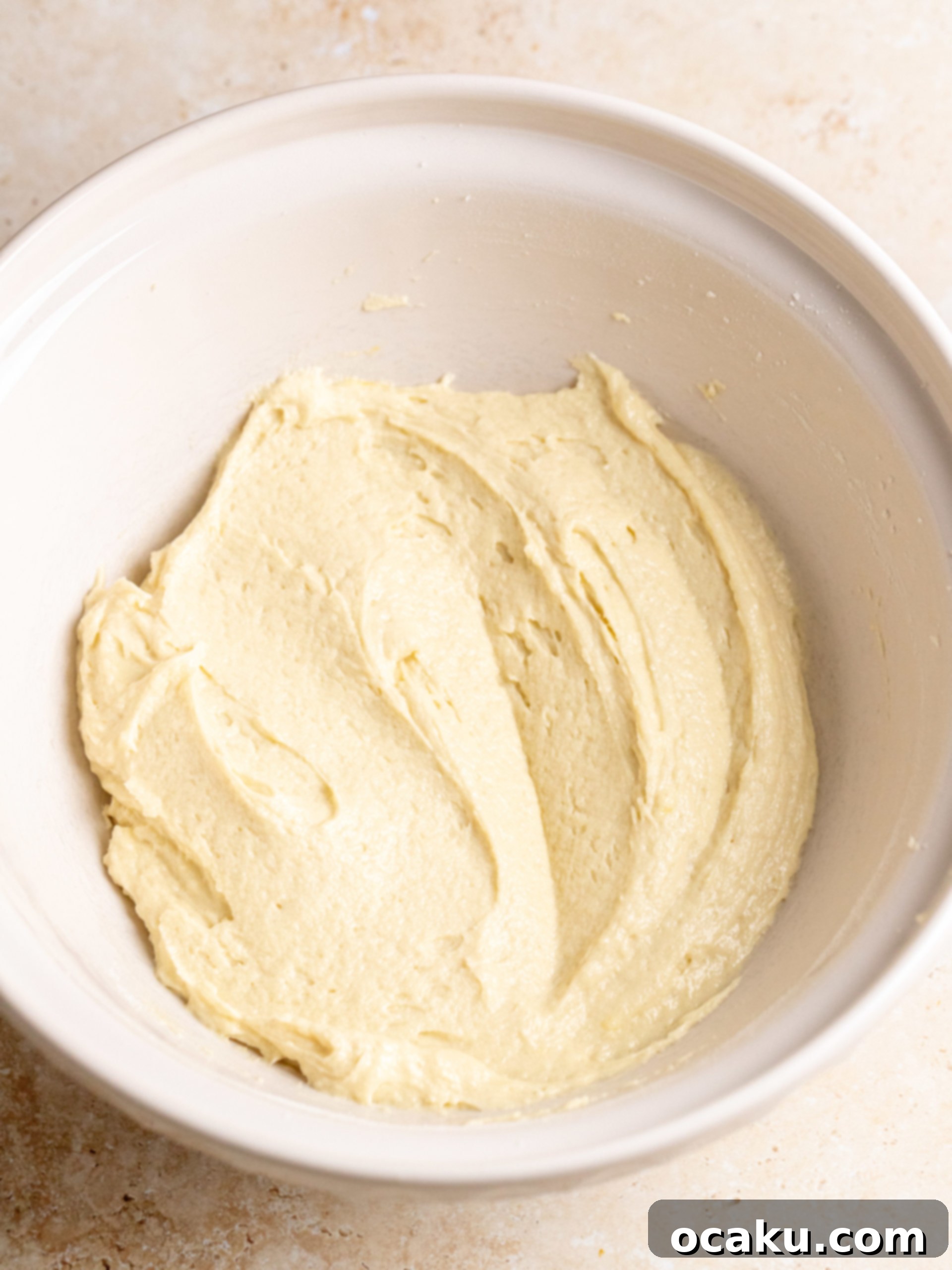 Cake batter in a mixing bowl after ingredients are combined.