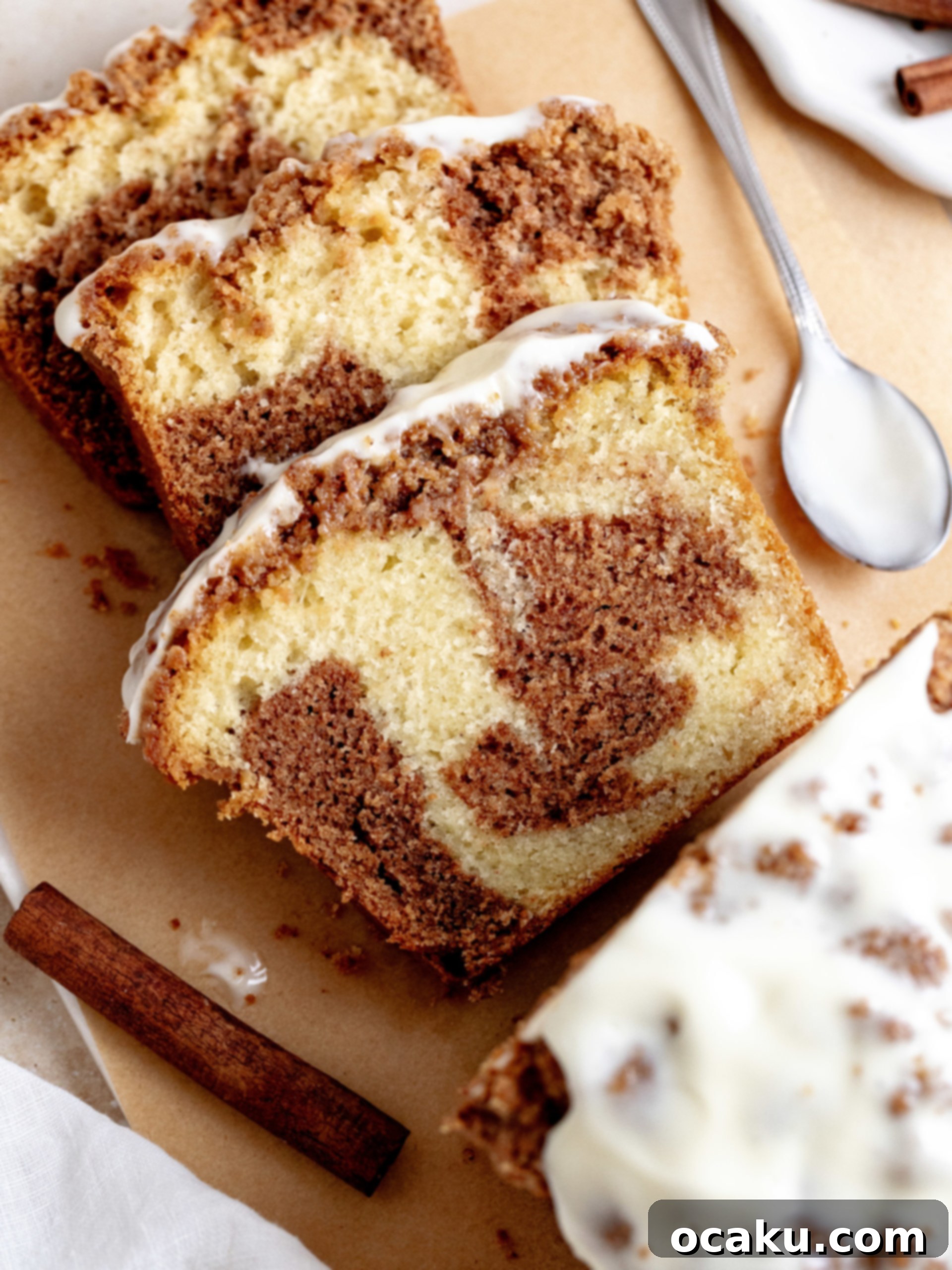 Freshly baked Cinnamon Loaf Cake with glaze, sliced