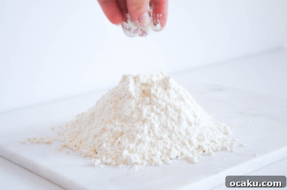 Homemade Cake Flour in a jar, with a bowl of cornstarch and flour