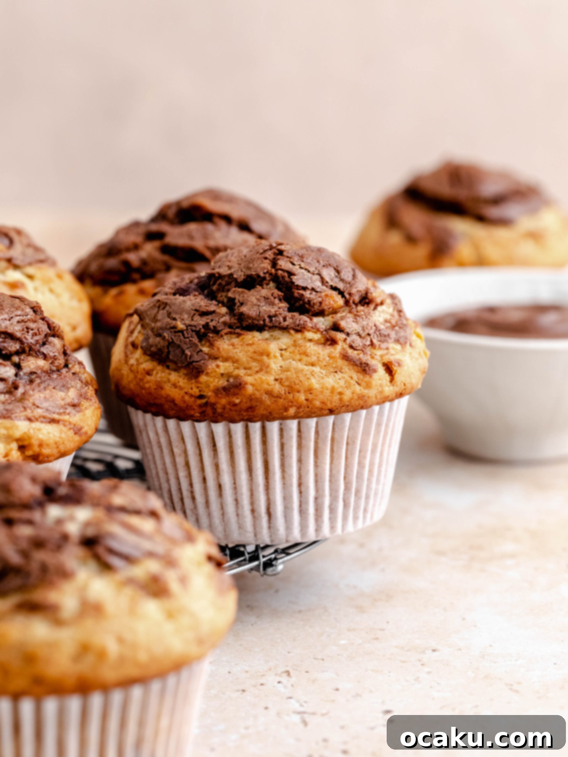 A spread of delicious banana Nutella muffins with a dusting of powdered sugar, ready to be served