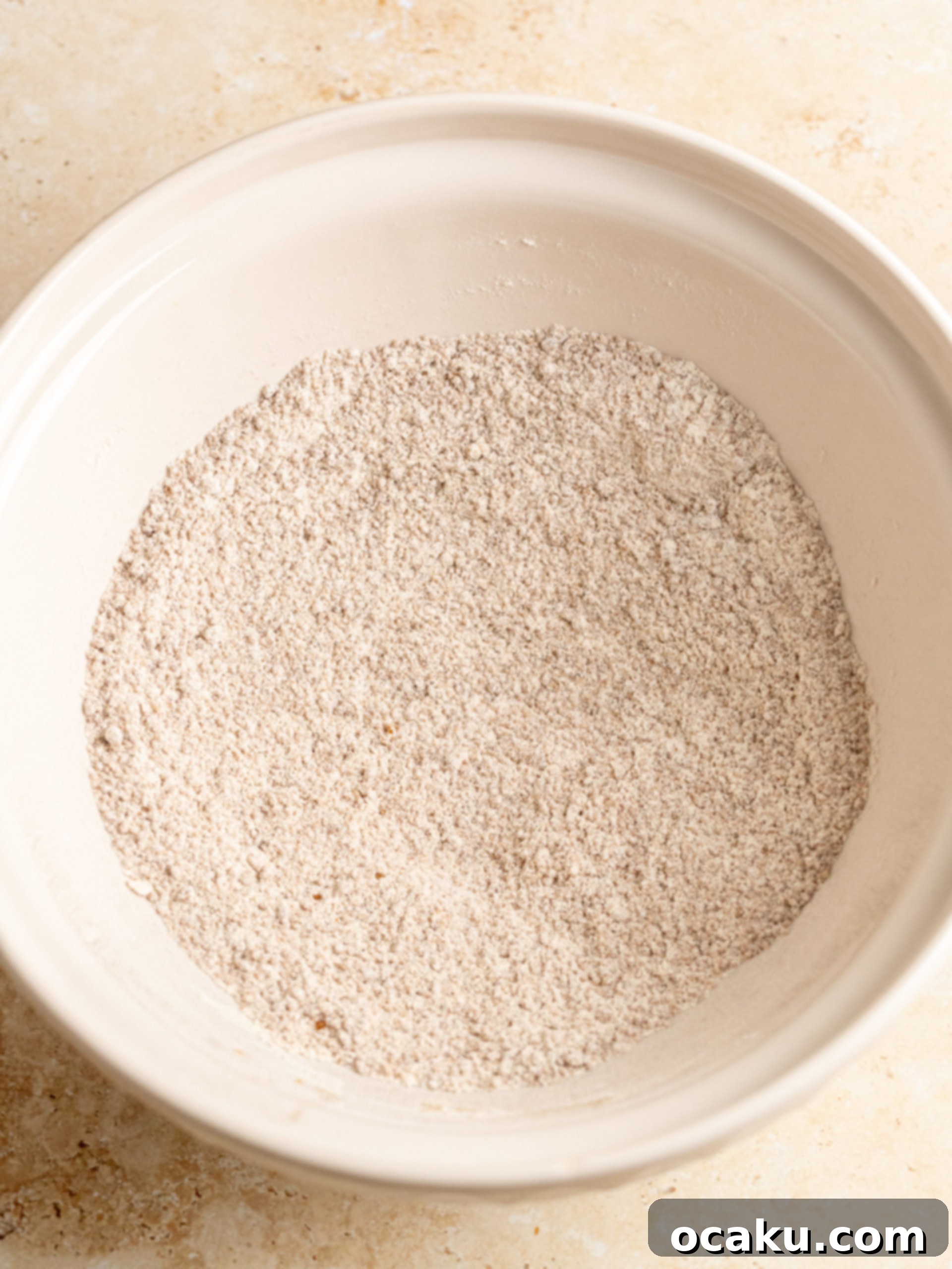Dry ingredients for pumpkin muffins in a bowl.