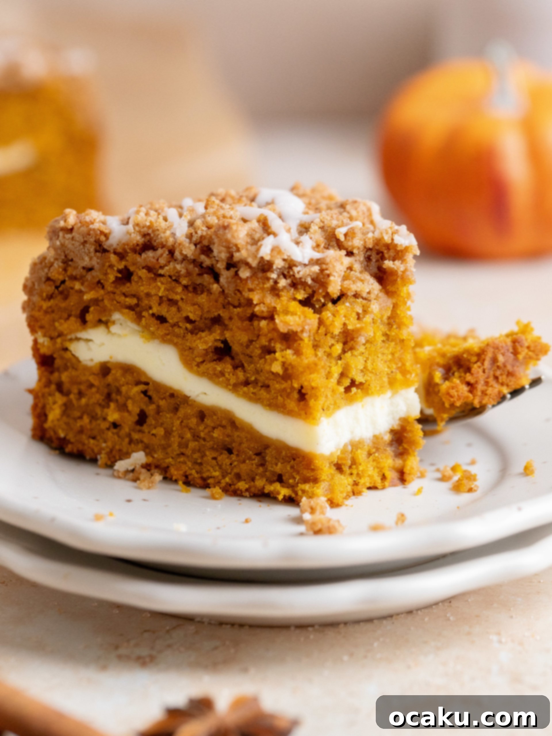 Another beautiful shot of a glazed Pumpkin Coffee Cake, sliced and ready to serve.