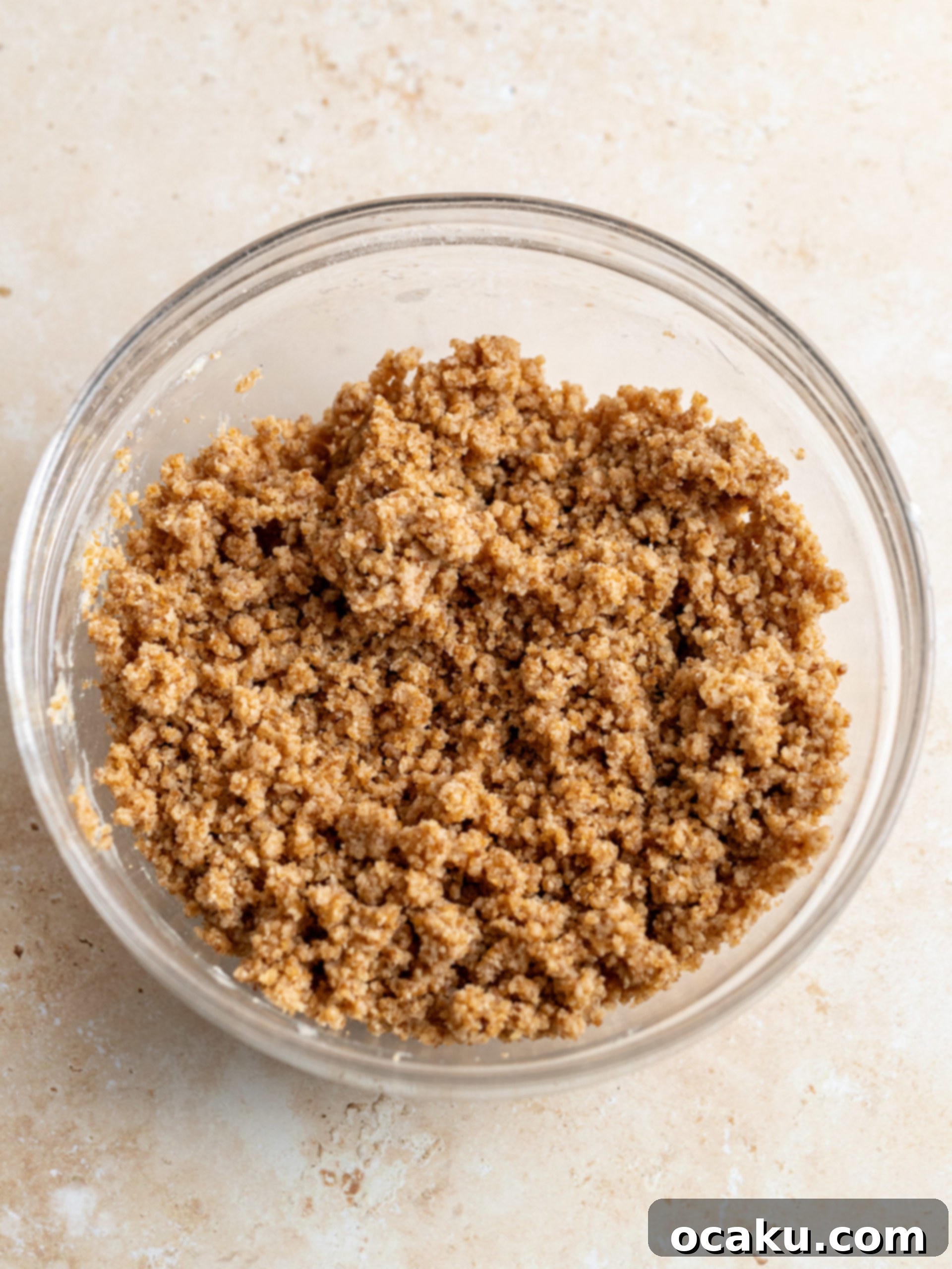 Half of the pumpkin cake batter in a springform pan.