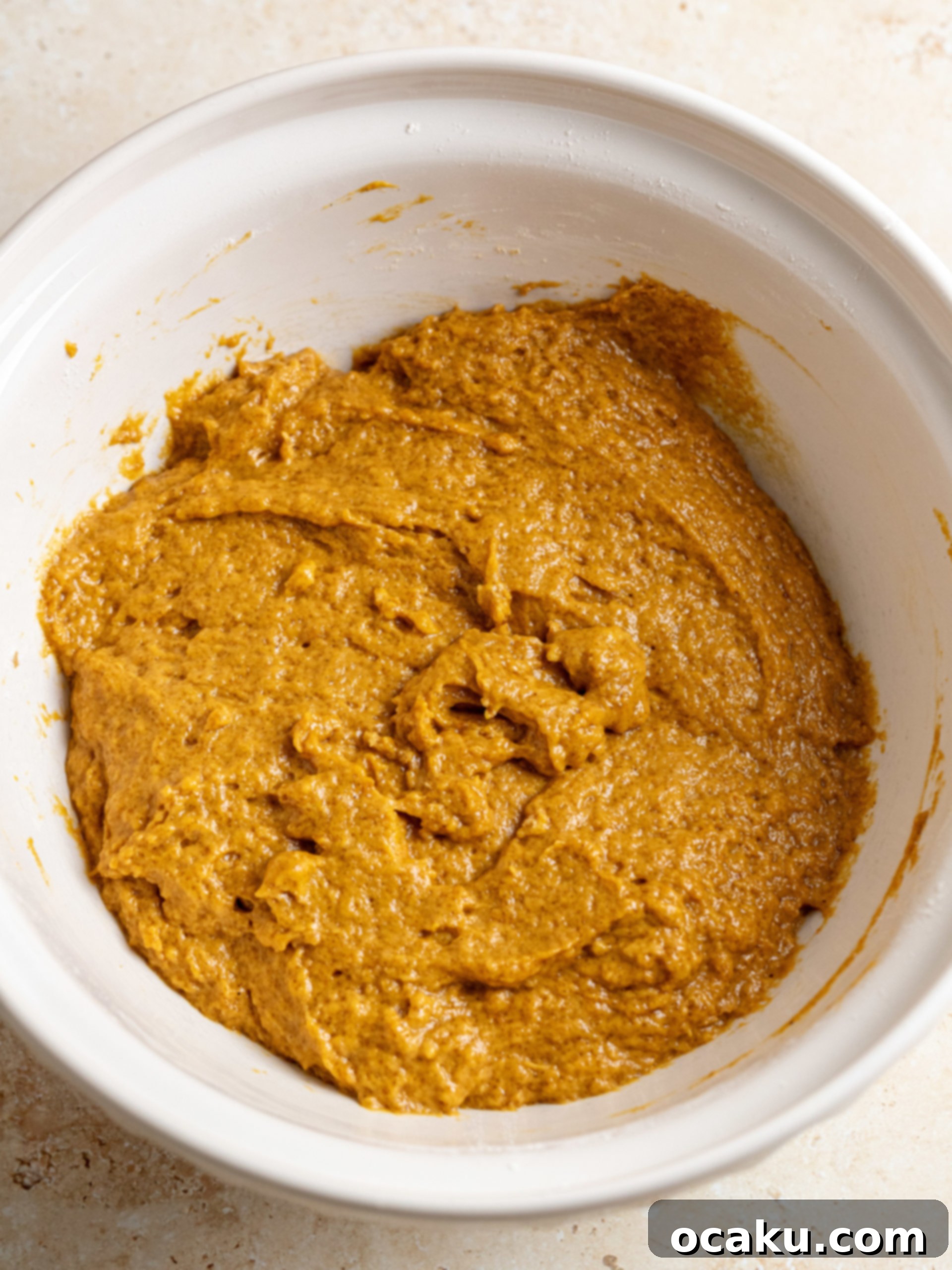 Pumpkin Coffee Cake with cream cheese and streusel before baking.