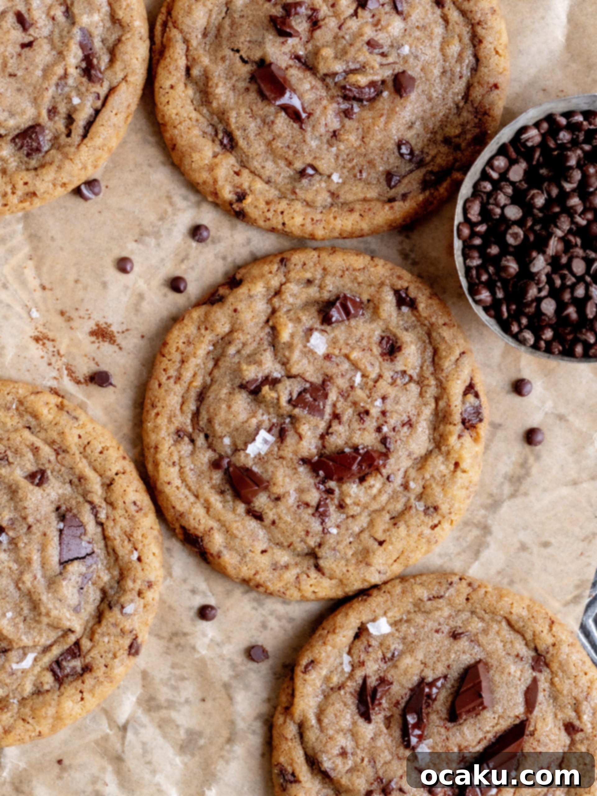 Close-up of a stack of chocolate chip coffee cookies showing their soft centers and crispy edges, ready to be devoured.