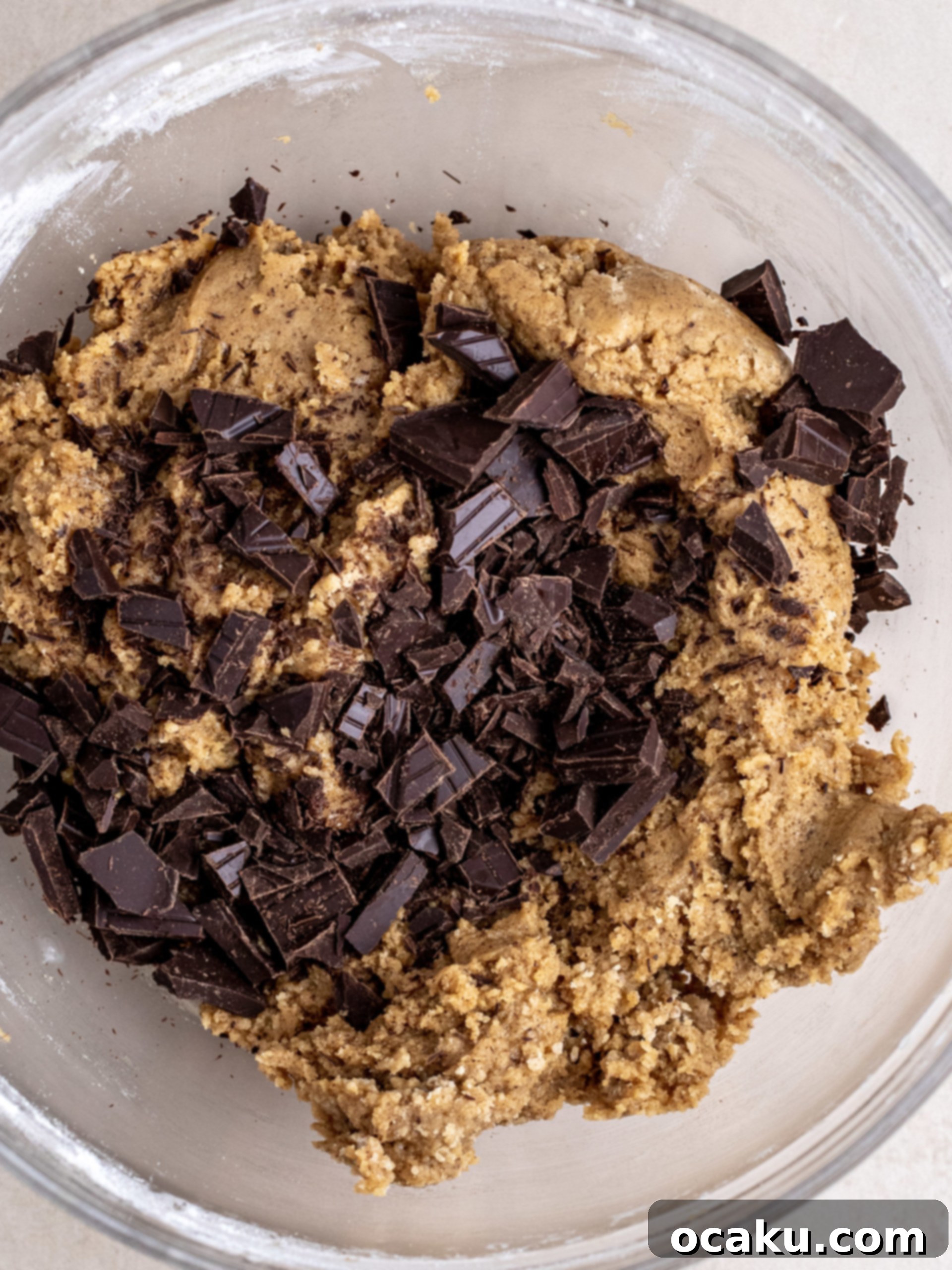 Portioned cookie dough balls arranged on a plate, ready for chilling.